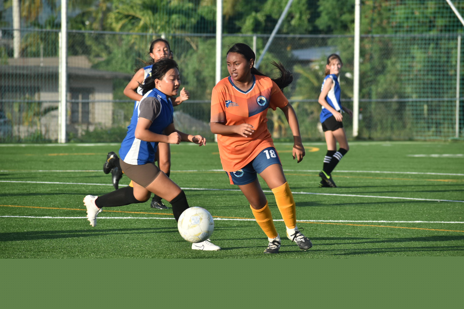 TMS' Haily Benavente dribbles past an SIS defender during a girls middle school division game of the NMIFA-PSS Interscholastic Soccer League on Tuesday at the NMI Soccer Training Center.
