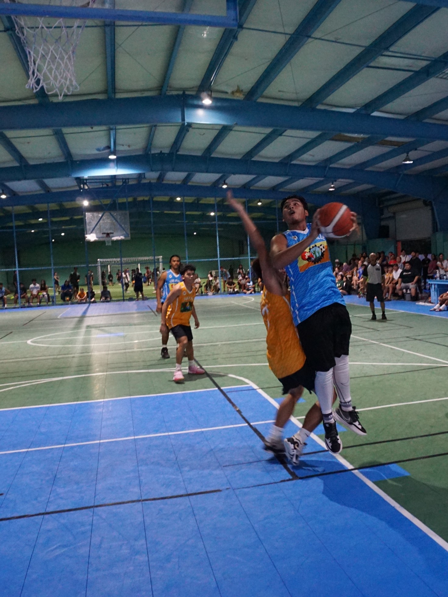 U18 Koblerville's Tynk Basa gets fouled as he goes up for the contested shot.