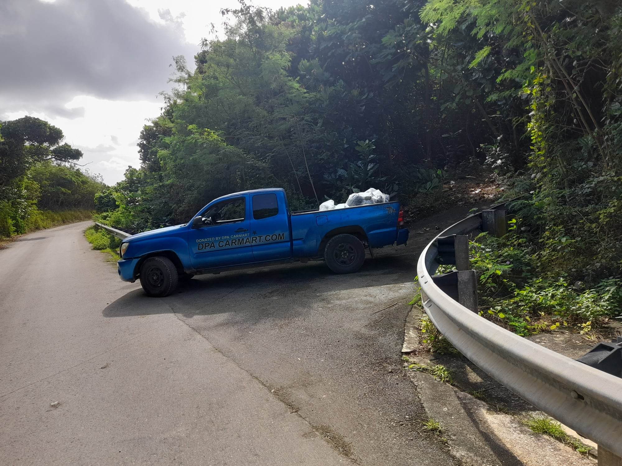 Community volunteer Max Aguon collected the trash he found in the Laulau Bay area for proper disposal.