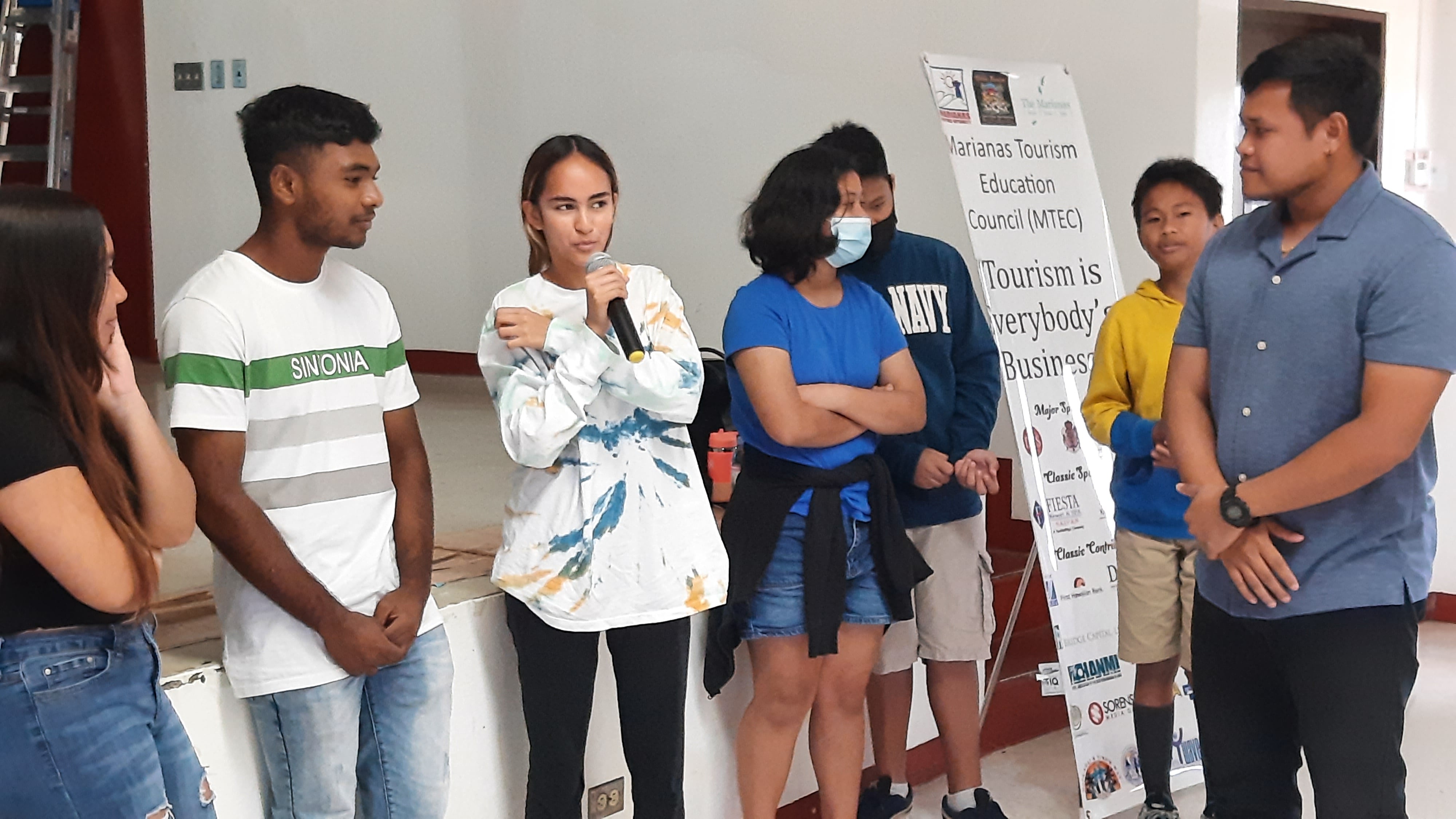 Students of Tinian Jr./Sr. High School share their knowledge of the Marianas tourism industry as Marianas Visitors Authority  Community Projects Specialist Jack Aranda, right, guides the dialogue. MVA and Marianas Tourism Education Council presented at the school on Feb. 17, 2023.