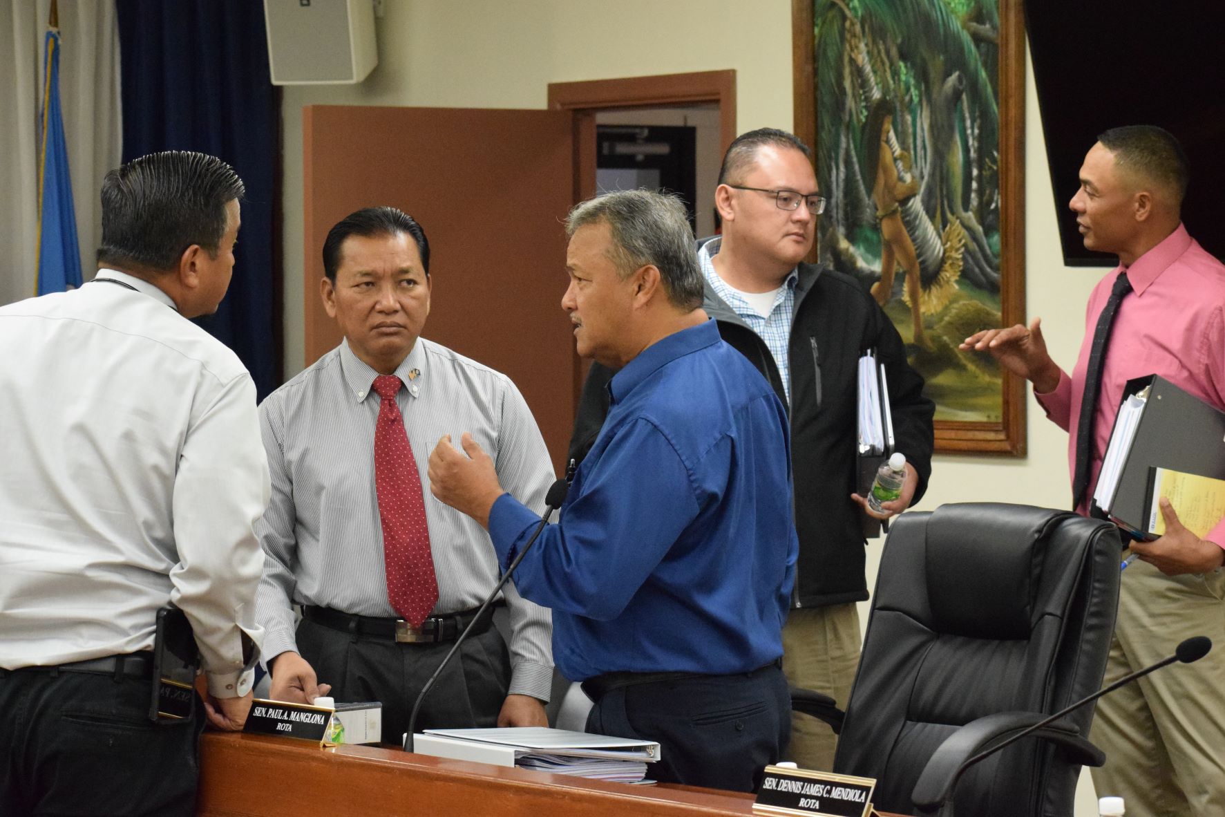 From left Sen. Jude U. Hofschneider, Sen. Frank Q. Cruz, Sen. Paul A. Manglona, Senate Vice President Donald M. Manglona and Sen. Dennis Mendiola confer after the adjournment of a Senate session on Tuesday.