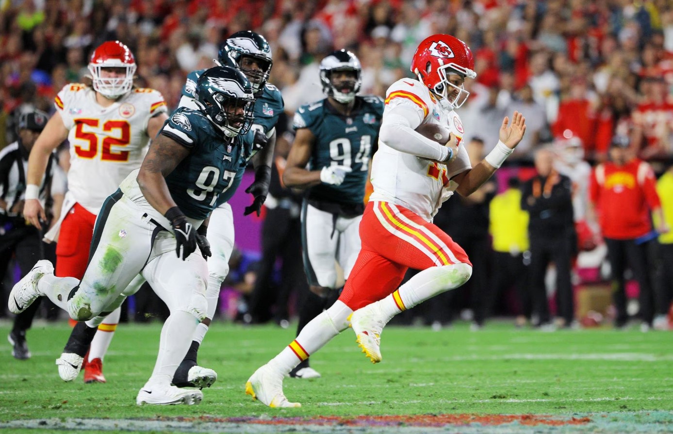 Kansas City Chiefs' Patrick Mahomes in Super Bowl action with Philadelphia Eagles' Javon Hargrave at the State Farm Stadium in Glendale, Arizona, Feb. 12, 2023.