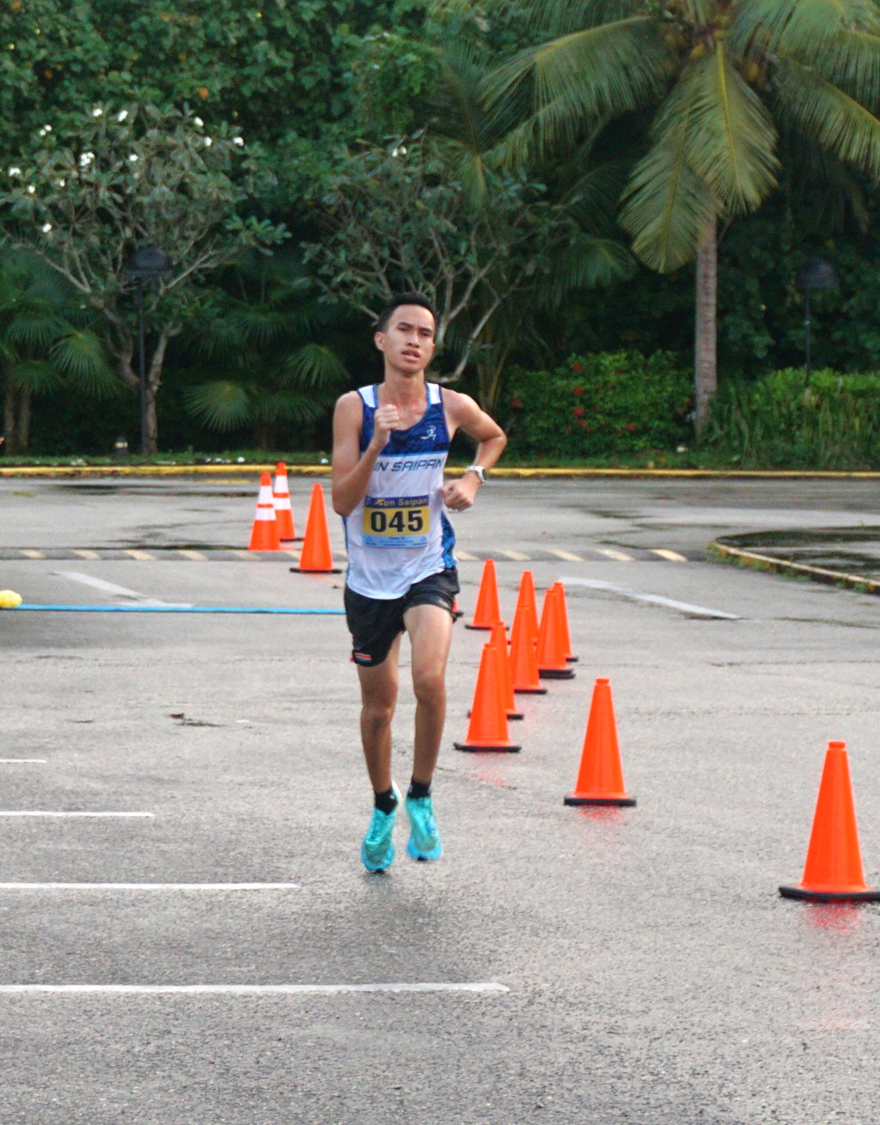 Sildrey Veloria finishes first in the inaugural Run Saipan Trinity race in the Kensington Hotel upper parking lot on Jan. 14, 2023.