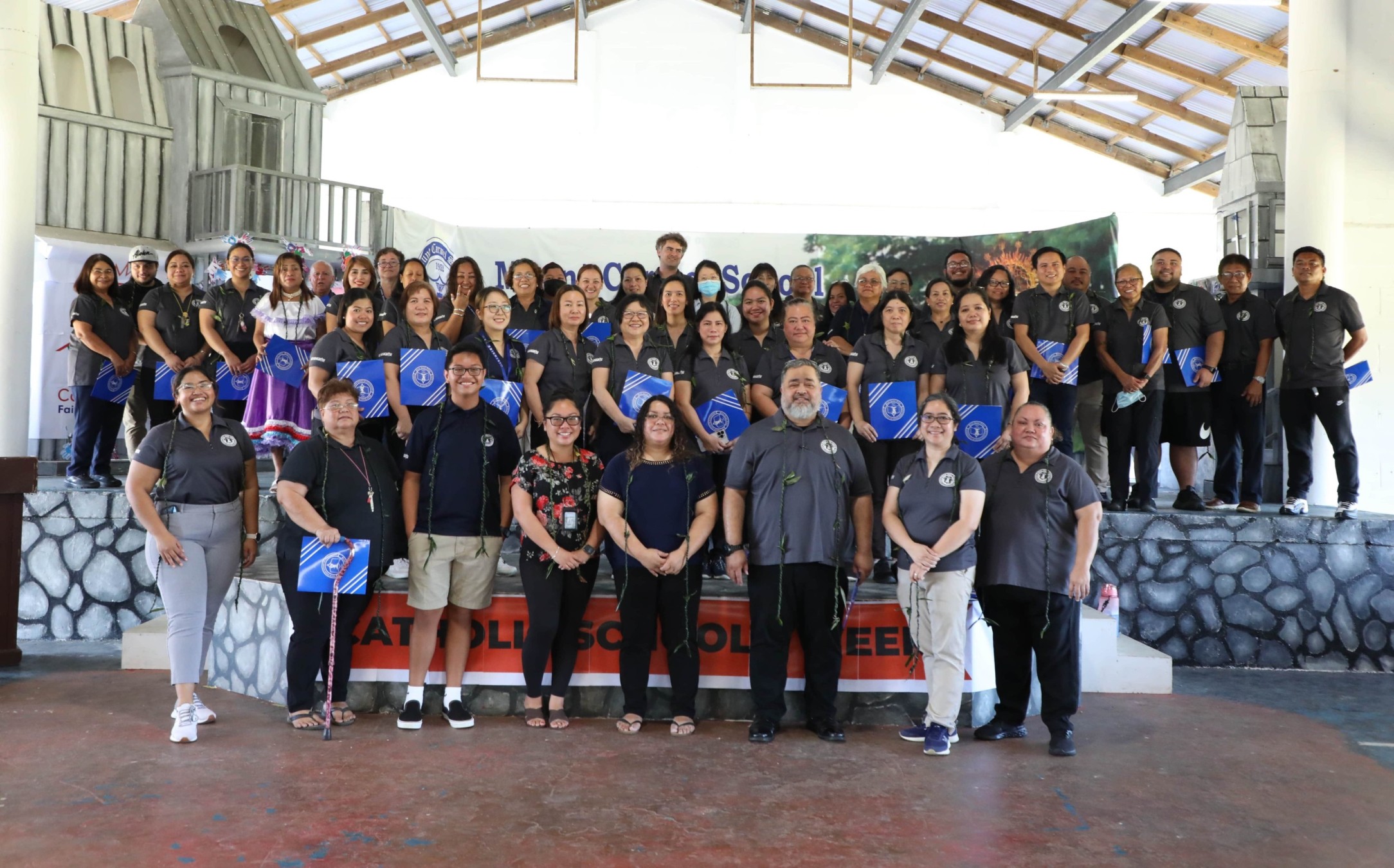All of Mount Carmel School’s faculty and staff take a group photo after receiving their Certificates of Appreciation during the 2022-2023 Catholic Schools Week: Celebrating Our Faculty and Staff Ceremony on Tuesday, Jan. 31, 2023.