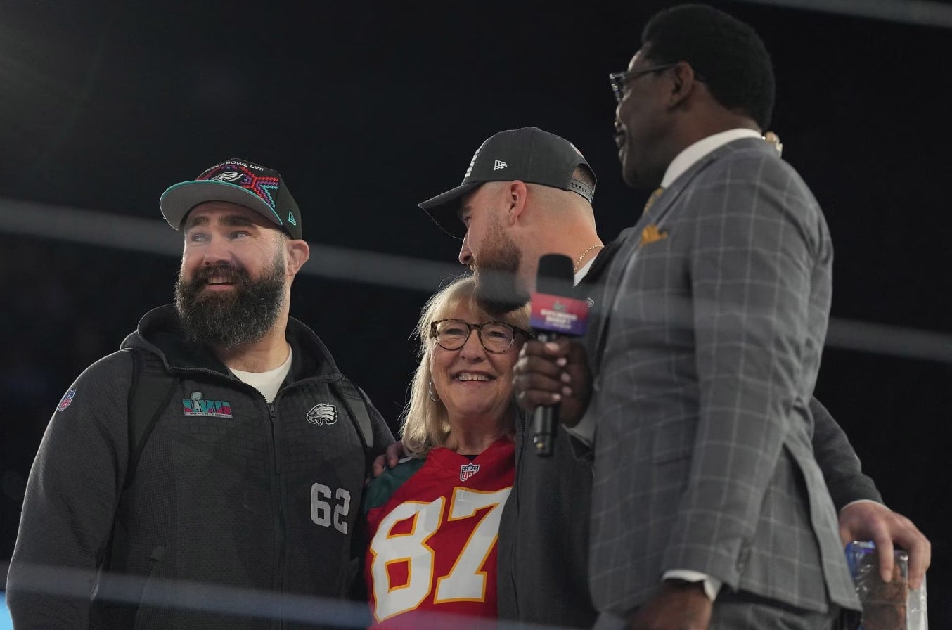 Philadelphia Eagles center Jason Kelce (62) and Kansas City Chiefs tight end Travis Kelce (87) with their mother Donna Kelce are interviewed by NFL Network reporter Michael Irvin during Super Bowl Opening Night at Footprint Center Phoenix, AZ,  Feb. 6, 2023.