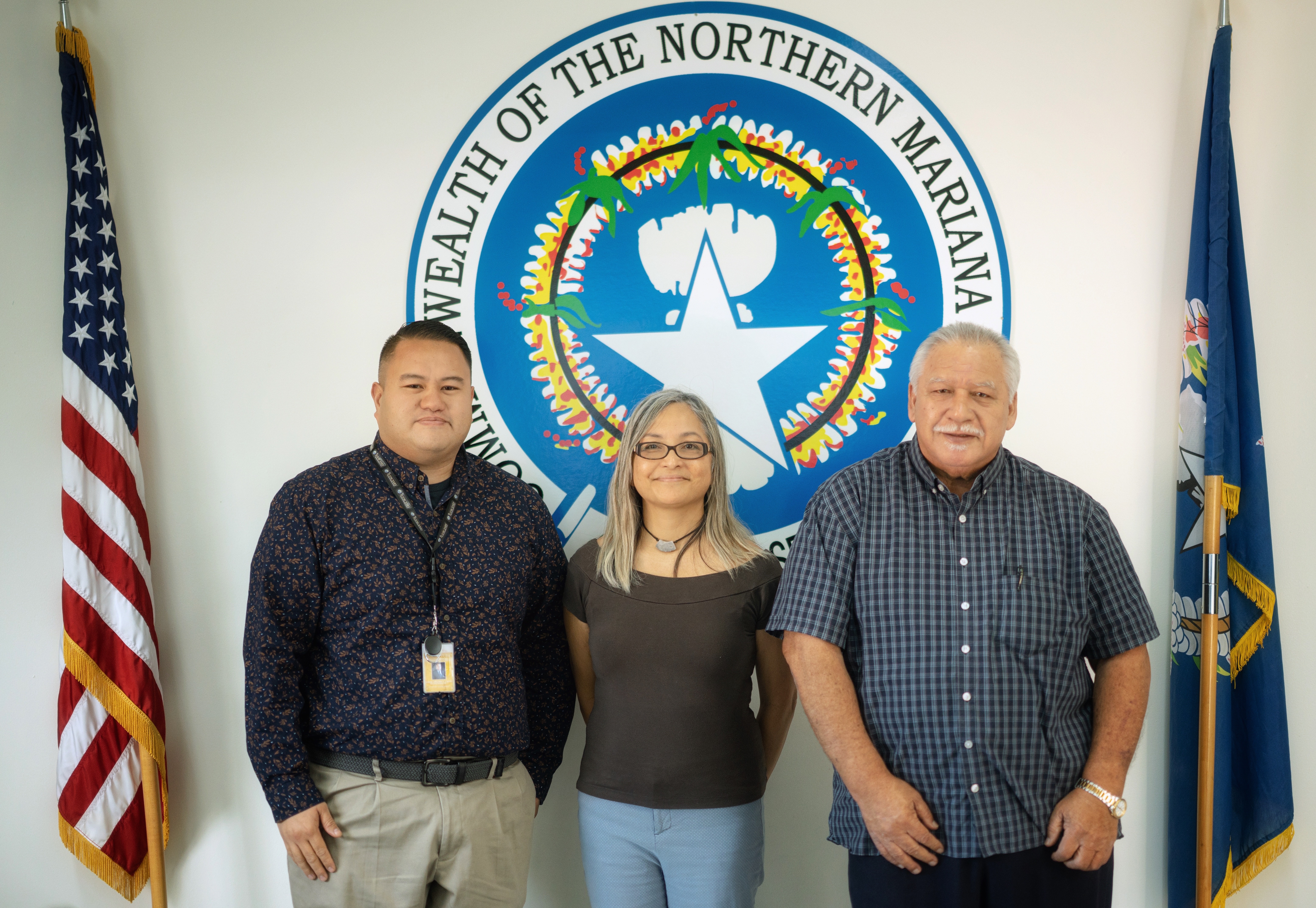 The chairman of the House Committee on Education, Rep. Manny Gregory Castro, left, and Rep. Roman Benavente, right, a former Board of Education chairman, with the newly sworn in teacher representative, Dr. Dora Borja Miura.
