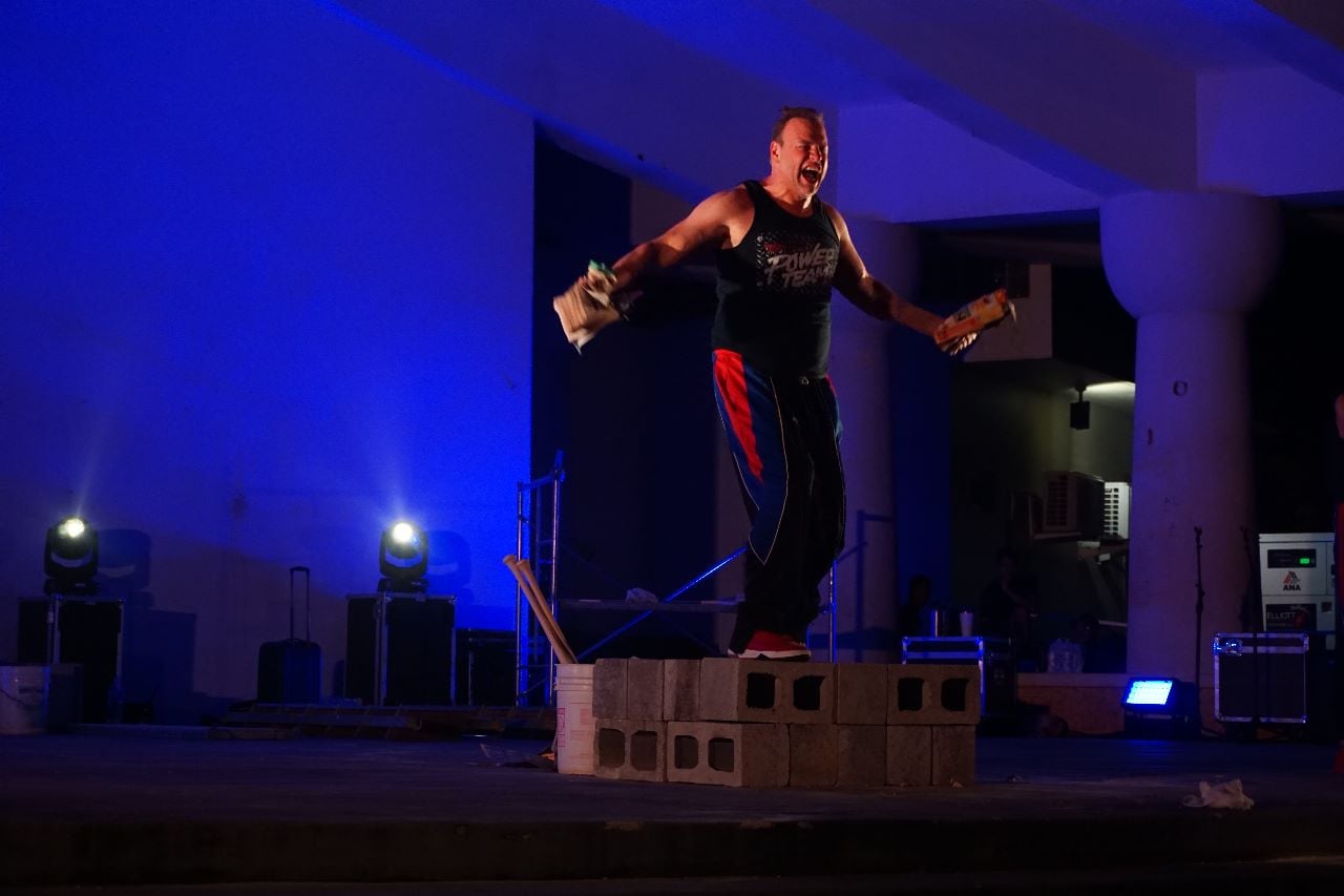 Power Team member Todd Keene successfully tears a 2,000-page book in half with his bare hands.