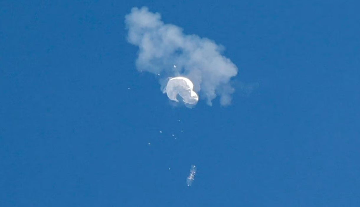 The suspected Chinese spy balloon drifts to the ocean after being shot down off the coast in Surfside Beach, South Carolina, Feb. 4, 2023.