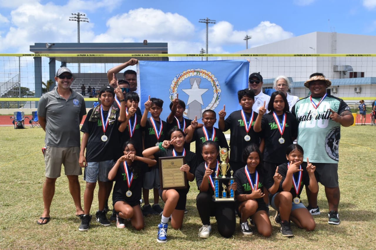 The Koblerville Elementary School Umangs pose for  a photo after winning  the co-ed elementary school division championship of the NMIVA-PSS Interscholastic Volleyball League at the Oleai Sports Complex on Saturday.