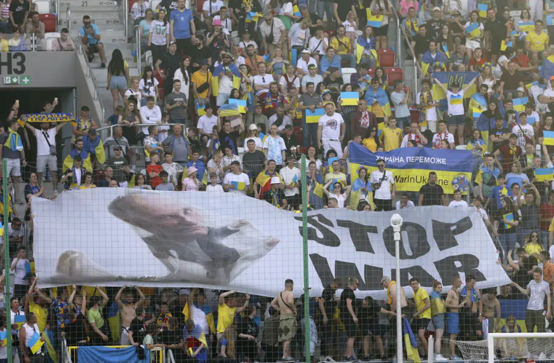 Ukraine supporters unfurl a "Stop War" banner on the stands during the UEFA Nations League soccer match between Ukraine and Armenia, in Lodz, Poland, on June 11, 2022.