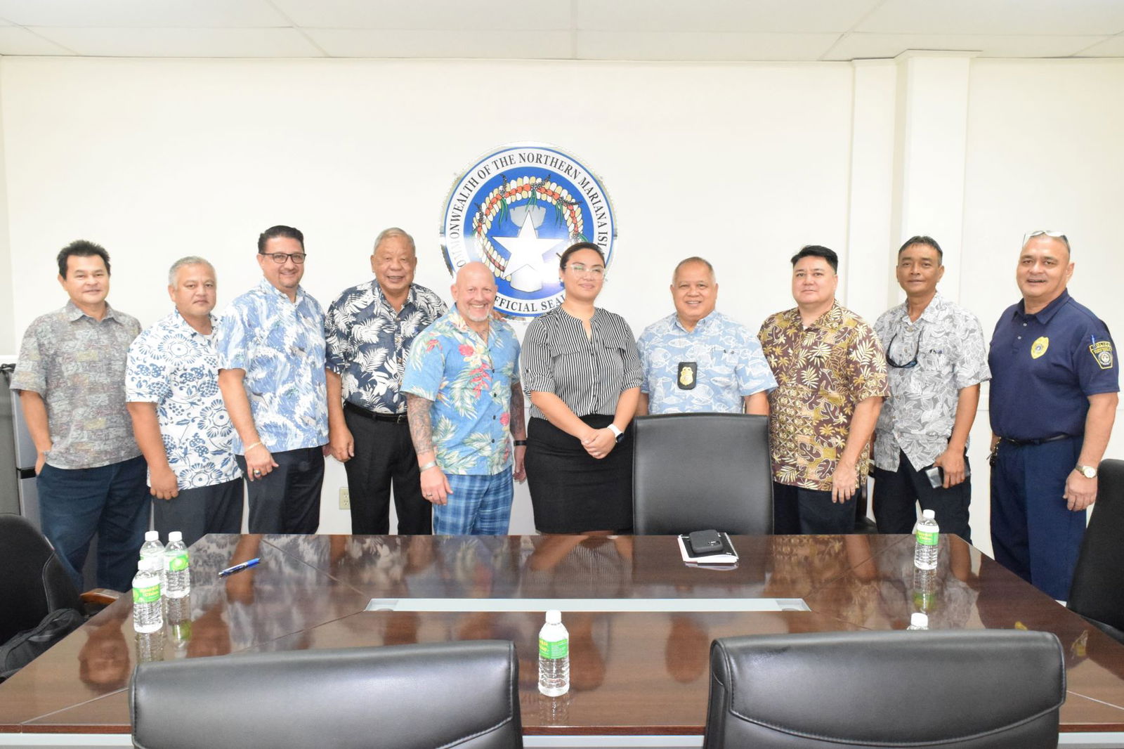 Acting Gov. David M. Apatang, fourth left, Acting Finance Secretary Tracy B. Norita, center, and Customs and Biosecurity Director Jose Mafnas, fourth right, pose for a photo with Homeland Security Investigations Assistant Director Jerry Templet Jr., fifth left, Honolulu Special Agent In Charge John F. Tobon, third left, HSI Marianas Special Agent In Charge John Duenas, second left, HSI CNMI Resident Agent In Charge, Mark Yamanaka, third right, Department of Public Safety Assistant Chief of Police Lawrence Camacho, right, Customs Branch Manager Marvin Sablan, second right, and Special Assistant to the Lieutenant Governor Henry S. Hofschneider, left, after the meeting on Friday in the governor's conference room.