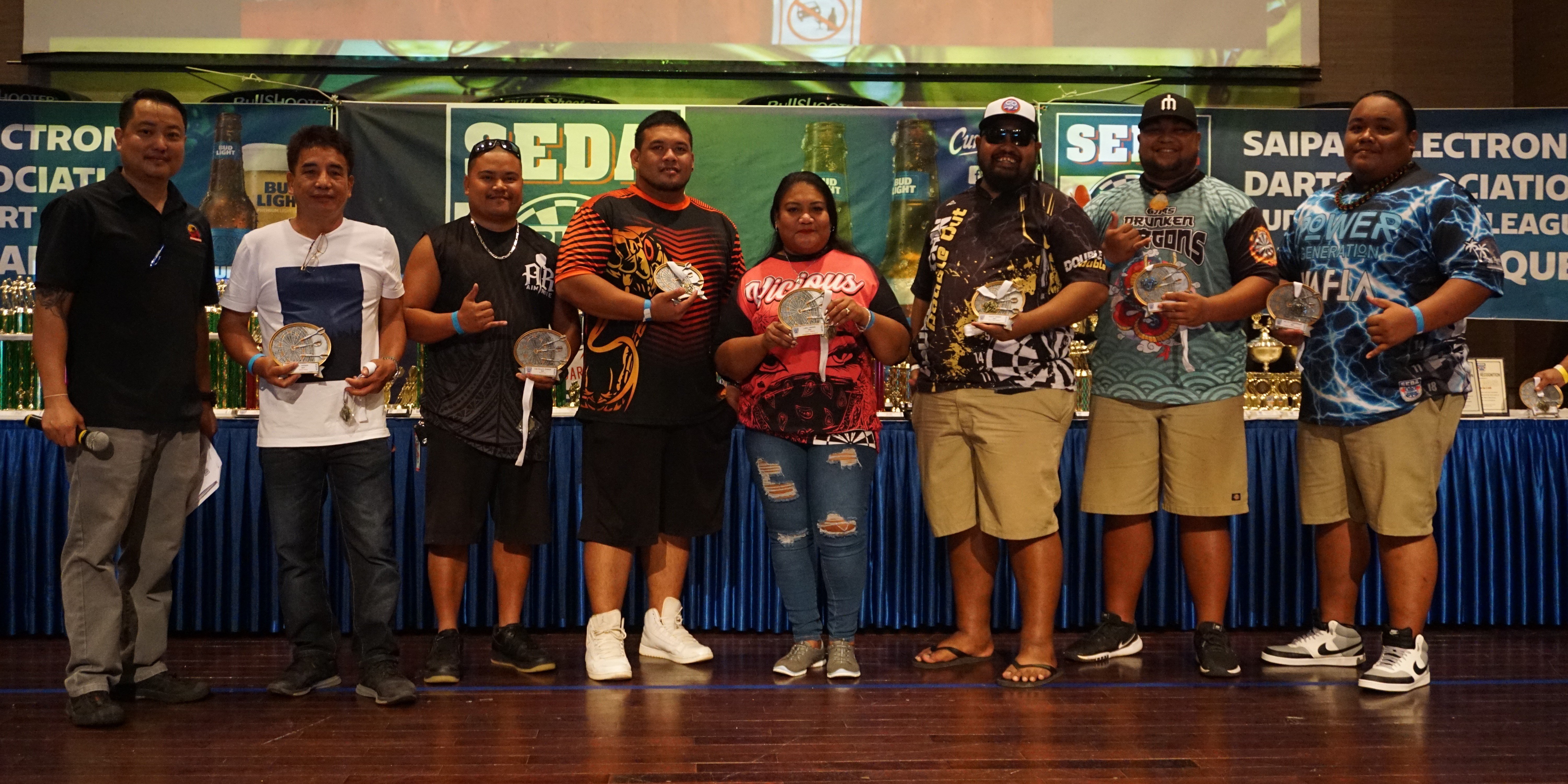 The MVP awardees of each division pose for a photo during the awards banquet of the 2022 SEDA Bud Light Dart League at the Saipan World Resort Taga Hall on Sunday.