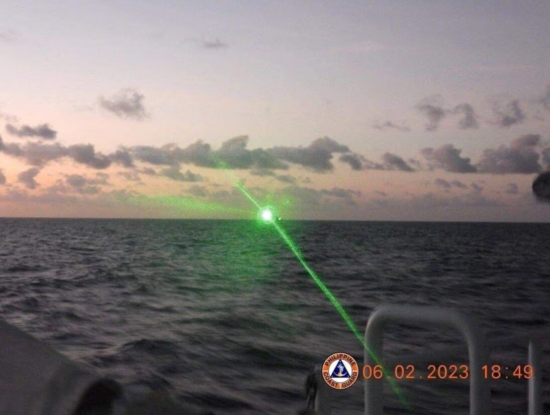 A green light appears from the direction of a Chinese coast guard ship at the Second Thomas Shoal, 105 nautical miles off the Palawan Province, the Philippines, Feb. 6, 2023.