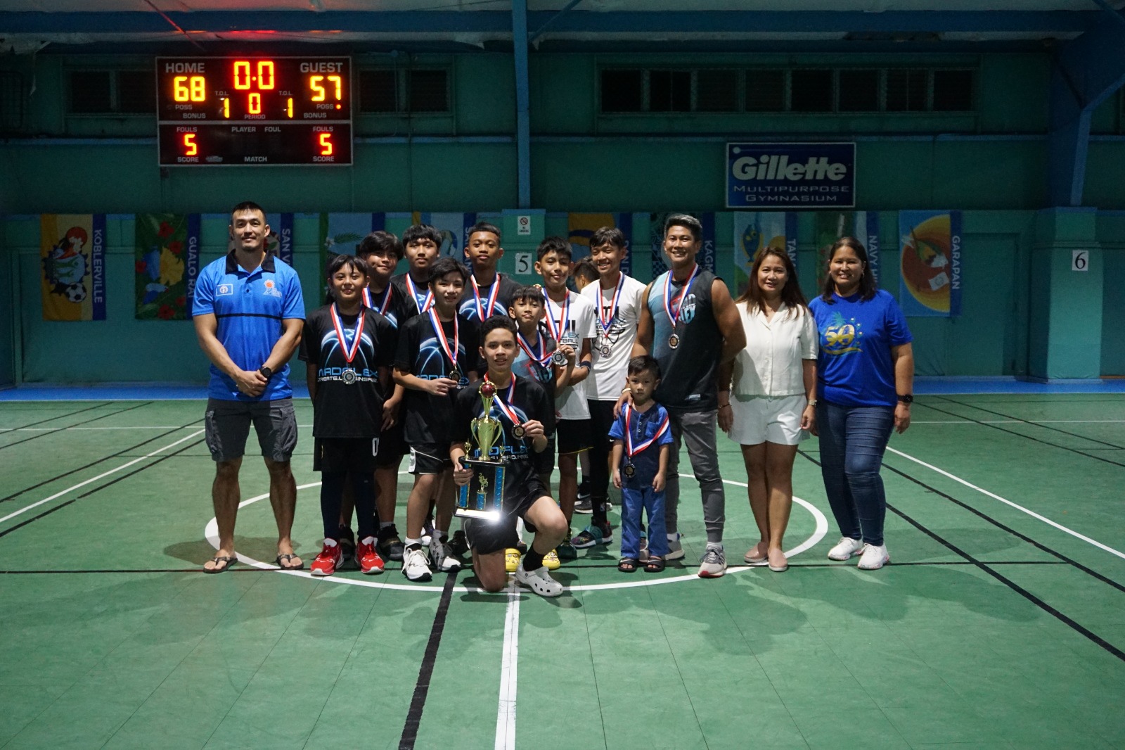 Team Tanapag players pose with the second-place trophy in the U13 division.
