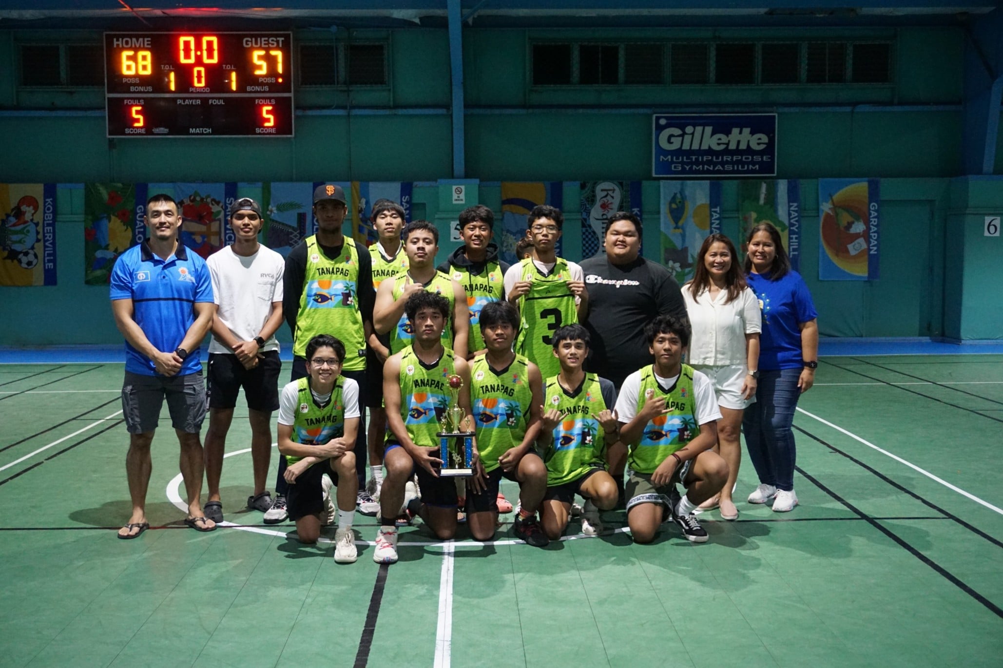 Team Tanapag players pose with the third-place trophy in the U18 boys division.