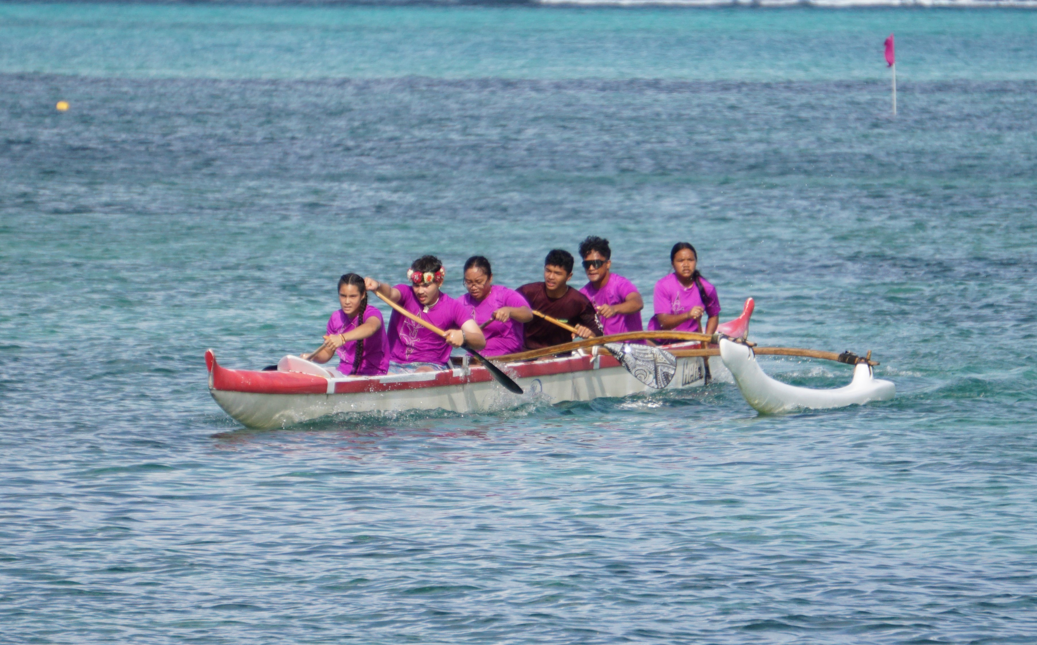 The KHS mixed team pushes through for the finish in the 1000m event of the PSS Interscholastic Outrigger Race Series at Kilili Beach on Saturday.