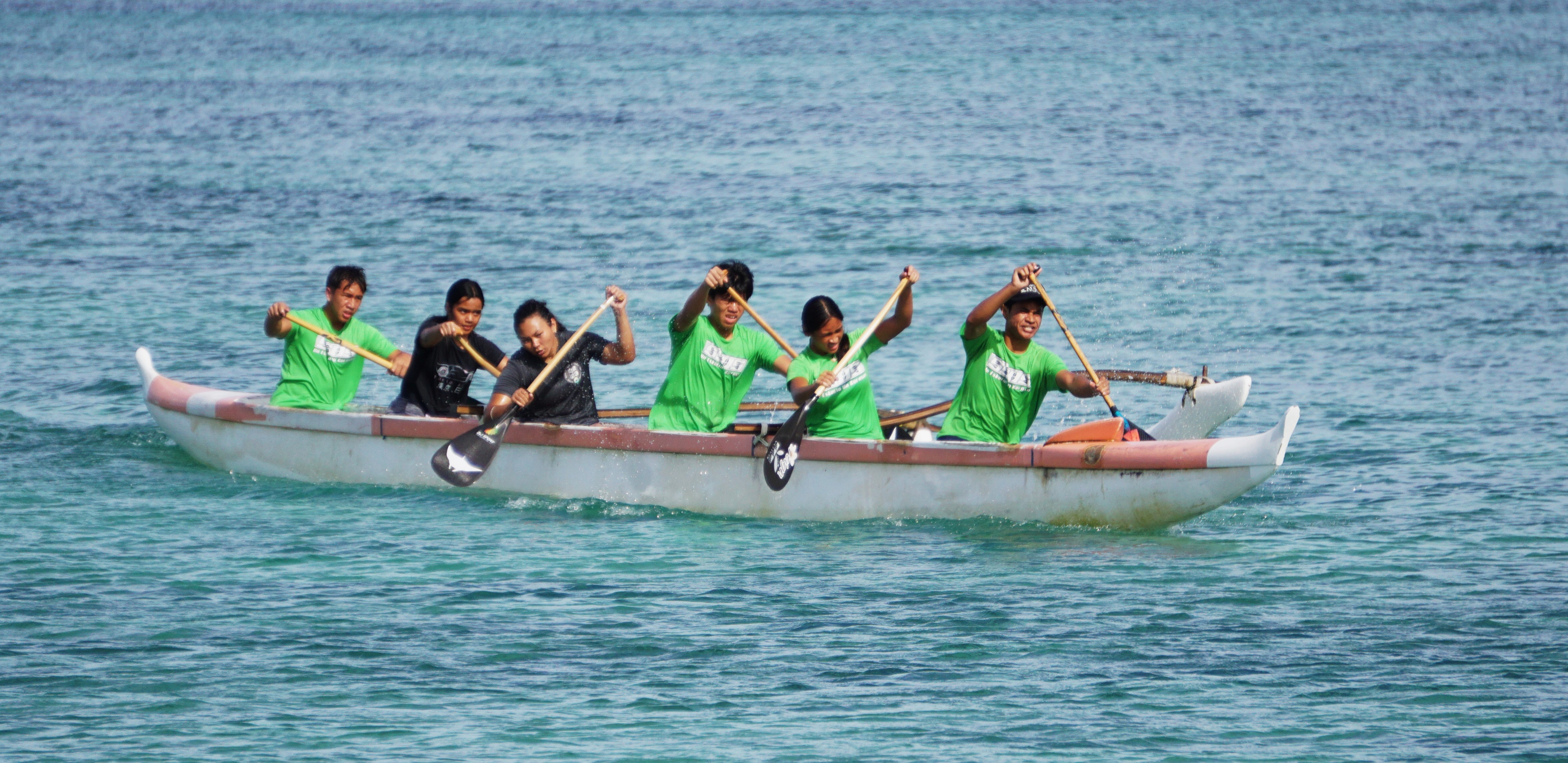 The SSHS mixed team members steer their way to victory in the high school 500m event of the PSS Interscholastic Outrigger Race Series at Kilili Beach on Saturday.