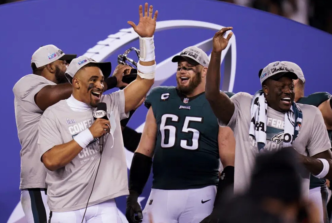 Philadelphia Eagles quarterback Jalen Hurts, left, offensive tackle Lane Johnson (65) and teammates react after the NFC Championship NFL football game between the Philadelphia Eagles and the San Francisco 49ers on Sunday, Jan. 29, 2023, in Philadelphia. The Eagles won 31-7.
