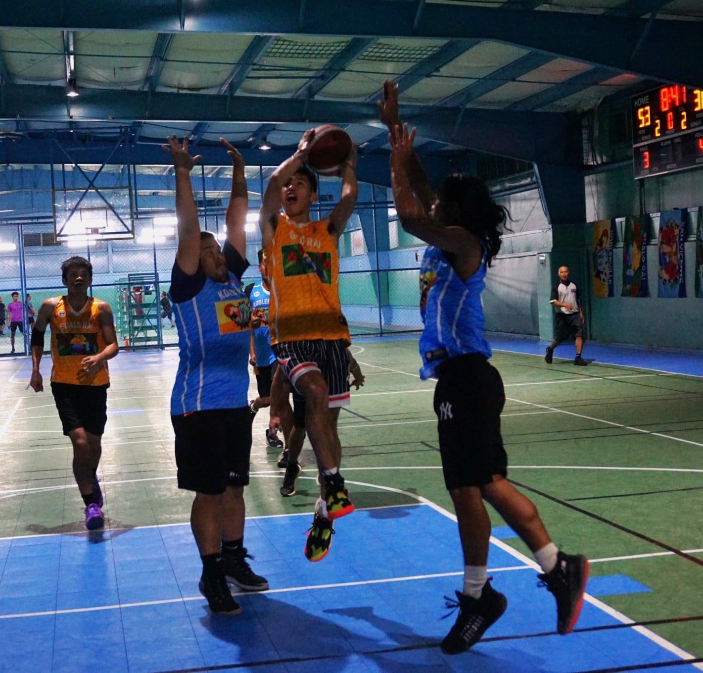 U18 Gualo Rai's Leo Naraja protects the ball as he rises for the finish. 