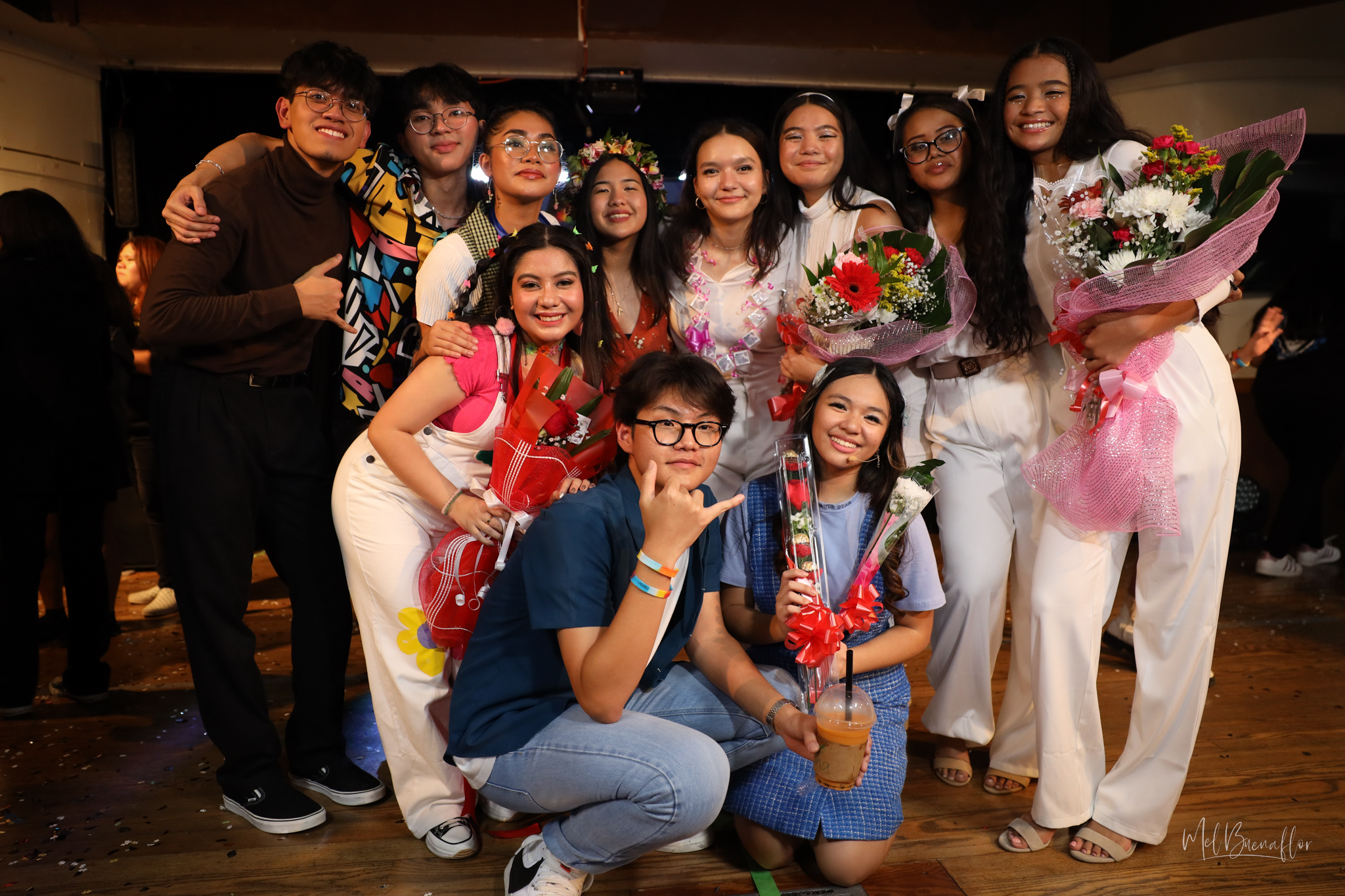 The lead cast members of the show gather with their director after curtain call. Front row: Bernice Shane Sabino, right, as Iris, Eunkyu "Joey" Hong as Luke, and Jill Anne Mallari as Kim. Second row, from left to right: Manuel Jacinto M. Pangelinan as Kin, Brent Matthew Estacio Ortizo  as Kyle, Kinamarie M. Dela Cruz as Ally, director Kyla Monique B. Cabrera, Brissa Concepcion Hunter as Regina, Kayannie Ilifighár Borja Peter as Karen, Moeisha Eleanor F. Cruz as Kara, and Maili Ilareyo'l Borja Peter as Karol.