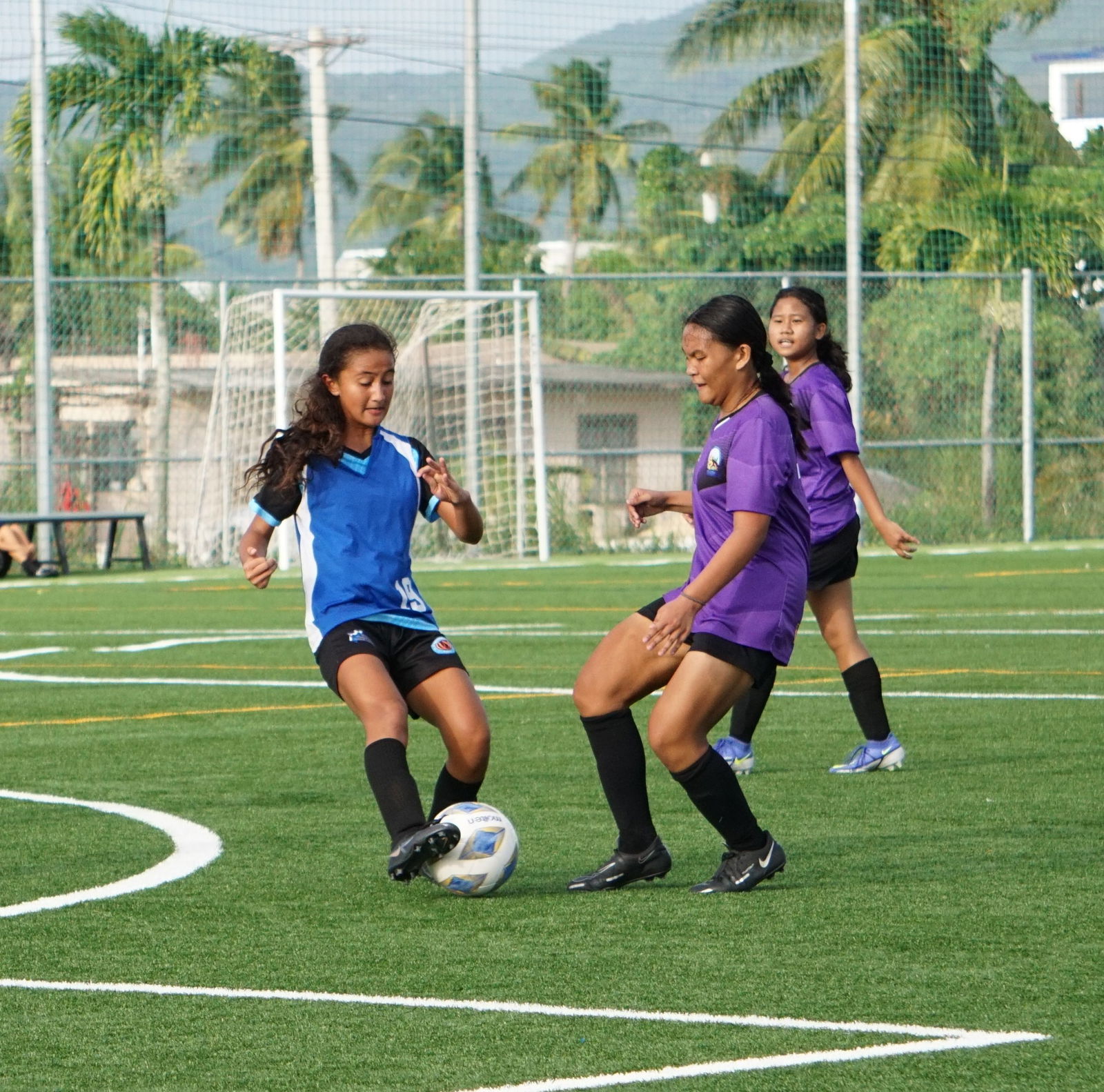  Beatrice Gross of SIS and Alyssa Borlongan of HMS battle for the possession during a girls middle school division game of the NMIFA-PSS Interscholastic Soccer League on Thursday last week at the NMI Soccer Training Center.