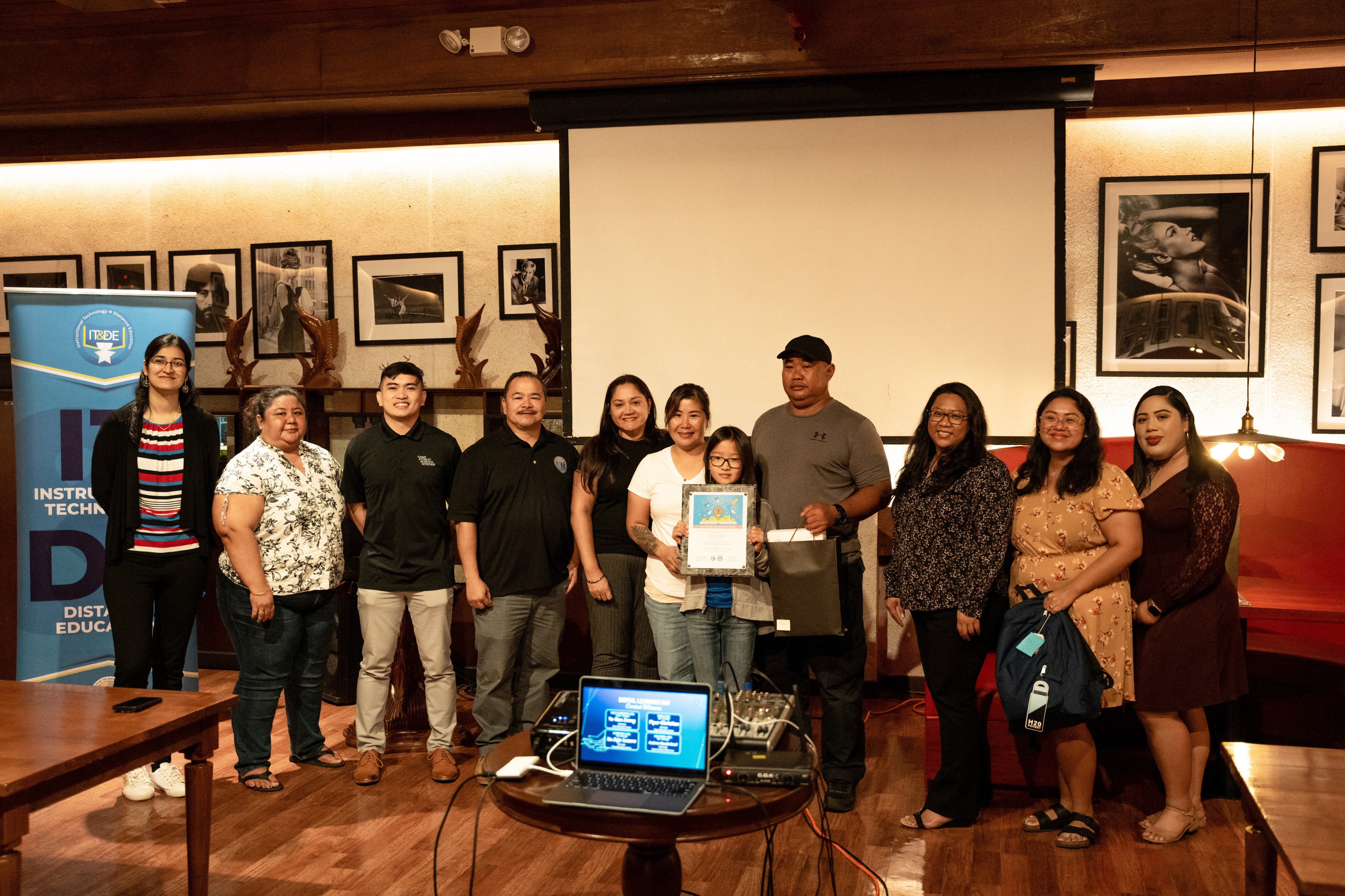 Tinian Elementary School 5th grade student Xu Jojo Lazaro is the winner for the 3rd-5th grade category. Photo shows her with her parents, Tinian Elementary School Principal Lou Conniee Manglona and PSS officials.