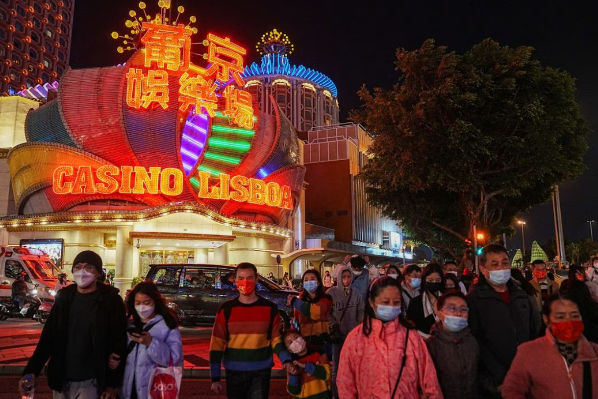 Visitors walk past the Casino Lisboa operated by SJM Holdings during Lunar New Year in Macau, China, Jan. 24, 2023.