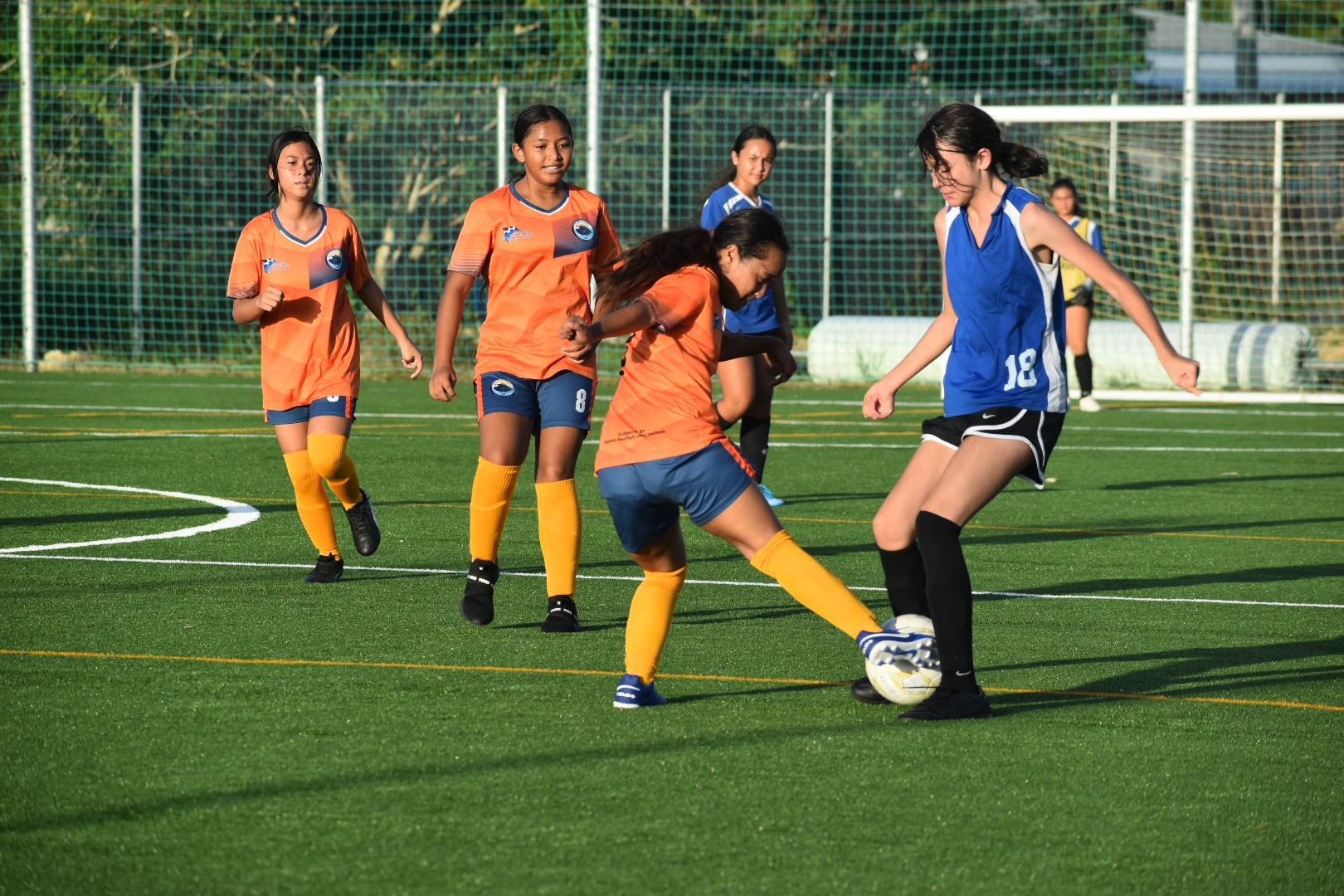 SIS' Reagan Gonzales tries to maintain possession as TMS' Hailey Benavente reaches for the steal during a girls middle school division game of the NMIFA-PSS Interscholastic Soccer League on Tuesday at the NMI Soccer Training Center.