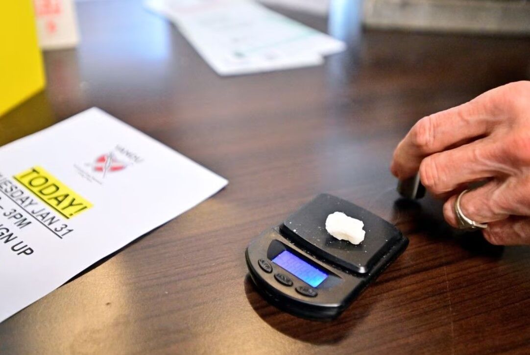 Dave Hamm, an ethical substance peer navigator with the Vancouver Area Network of Drug Users, weighs a piece of rock cocaine as the province of British Columbia decriminalized the possession of small amounts of cocaine, methamphetamine, MDMA and opioids like heroin, fentanyl and morphine, in the Downtown Eastside of Vancouver, British Columbia, Canada, Jan. 31, 2023.