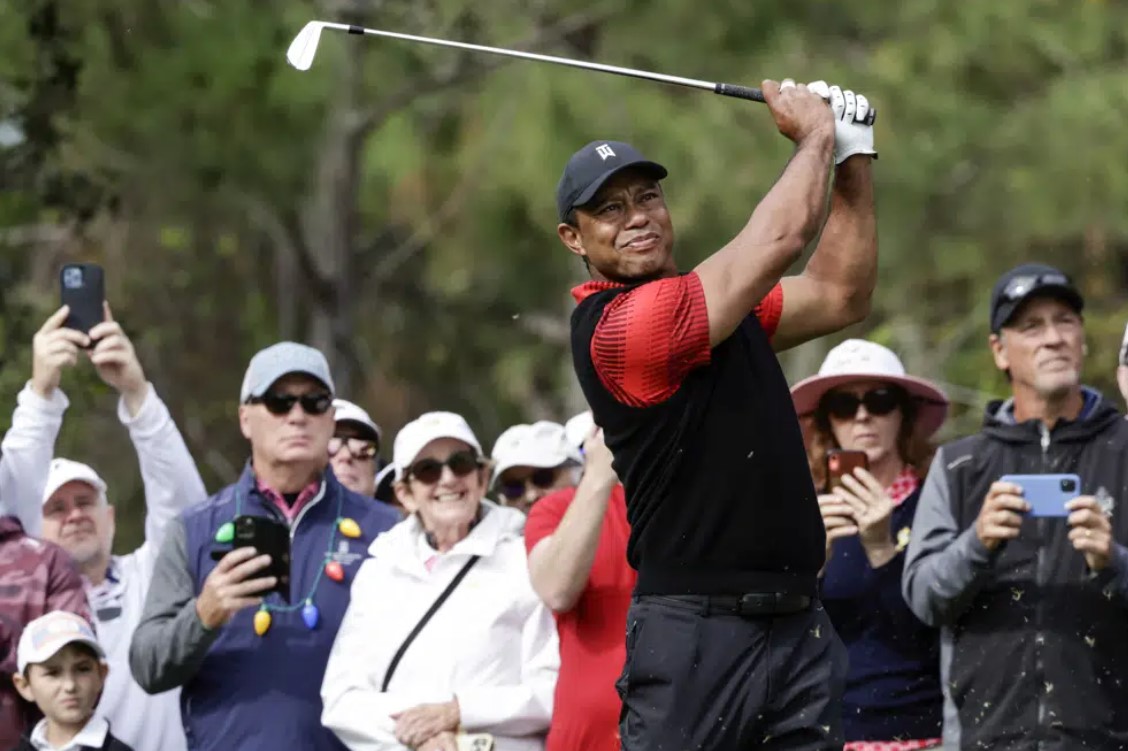 Tiger Woods tees off on the 4th hole during the final round of the PNC Championship golf tournament Sunday, Dec. 18, 2022, in Orlando, Fla.