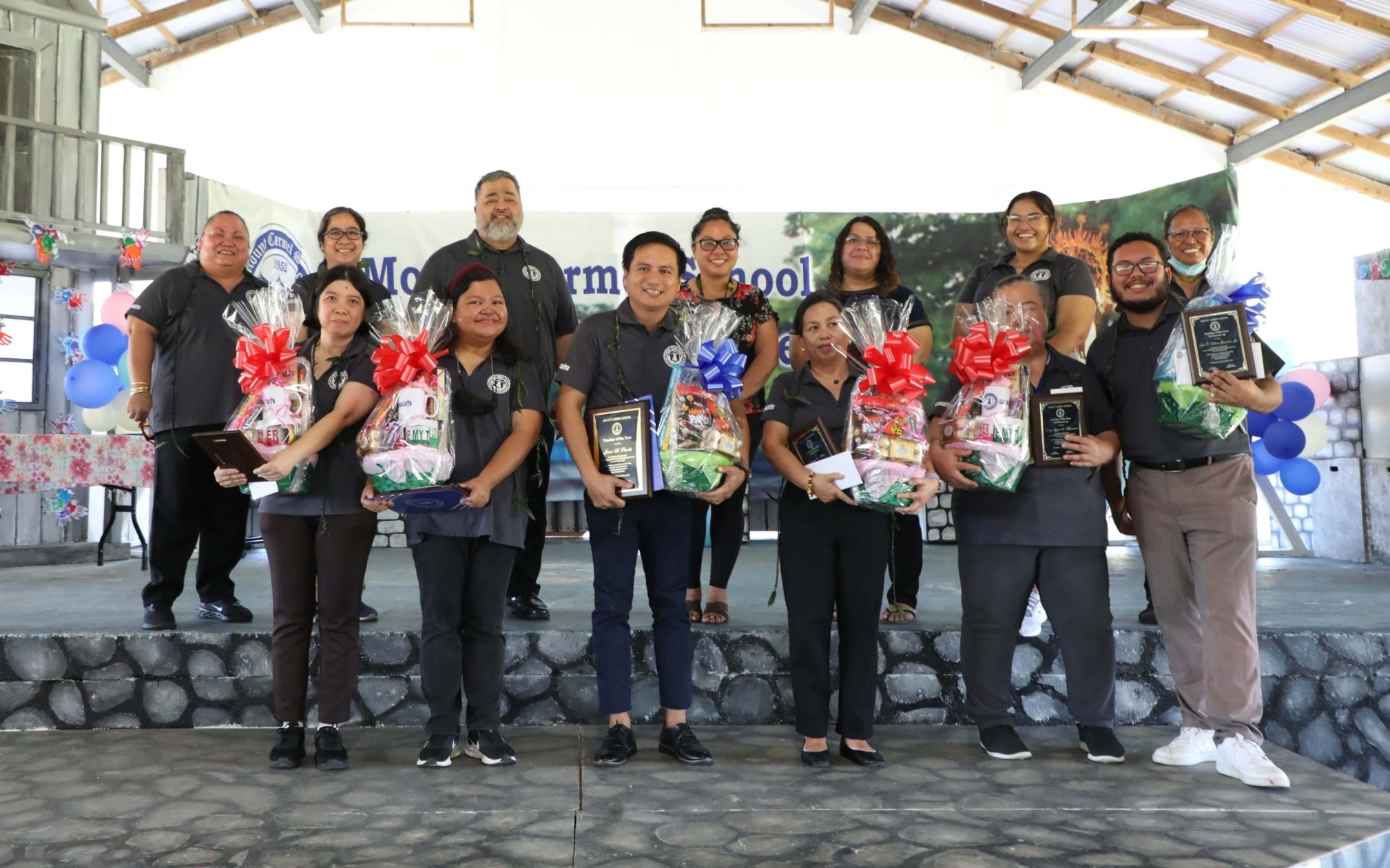 All the awardees during Mount Carmel School’s celebration of its faculty and staff stand for a group photo. In the photo, from left, top row, are MCS President Ms. Frances Taimanao, MCS Principal Ms. Filmah Buenaflor, MCS Business Manager Mr. John S. Blanco, MCS Parent Council Secretary Ms. Mai Mendola, MCS Parent Council President Ms. Tina Crisostimo Tudela, MCS Director of Institutional Development Ms. Victoria Deleon Guerrero, and MCS School Counselor Ms. Tobed Smith. At the bottom row, from left,  2023 Support Staff of the Year Finalist Ms. Shyaralyn San Nicolas,  2023 Support Staff of the Year Ms. Suzanne Jetnil, 2023 Teacher of the Year Mr. Jener Pineda, 2023 Teacher of the Year Finalist Ms. Criselda Aldan, 2023 Teacher of the Year Finalist Tracy Taimanao, and 2023 Teacher of the Year Finalist Zeno Deleon Guerrero Jr.