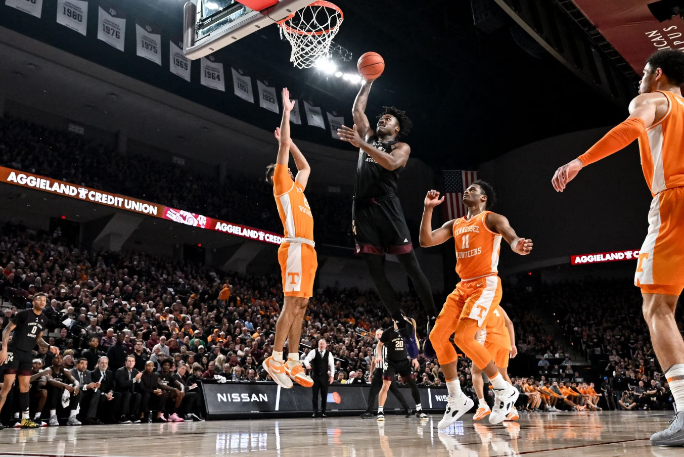Texas A&M Aggies forward Julius Marble (34) drives to the basket against Tennessee Volunteers guard Santiago Vescovi (25) during the second half at Reed Arena in College Station, Texas, Feb 21, 2023.