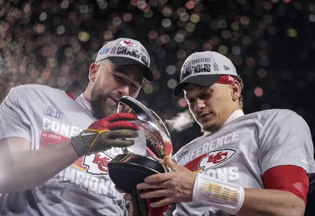 Kansas City Chiefs tight end Travis Kelce, left, and teammate quarterback Patrick Mahomes celebrate after the NFL AFC Championship playoff football game against the Cincinnati Bengals, Sunday, Jan. 29, 2023, in Kansas City, Mo. The Chiefs won 23-20.