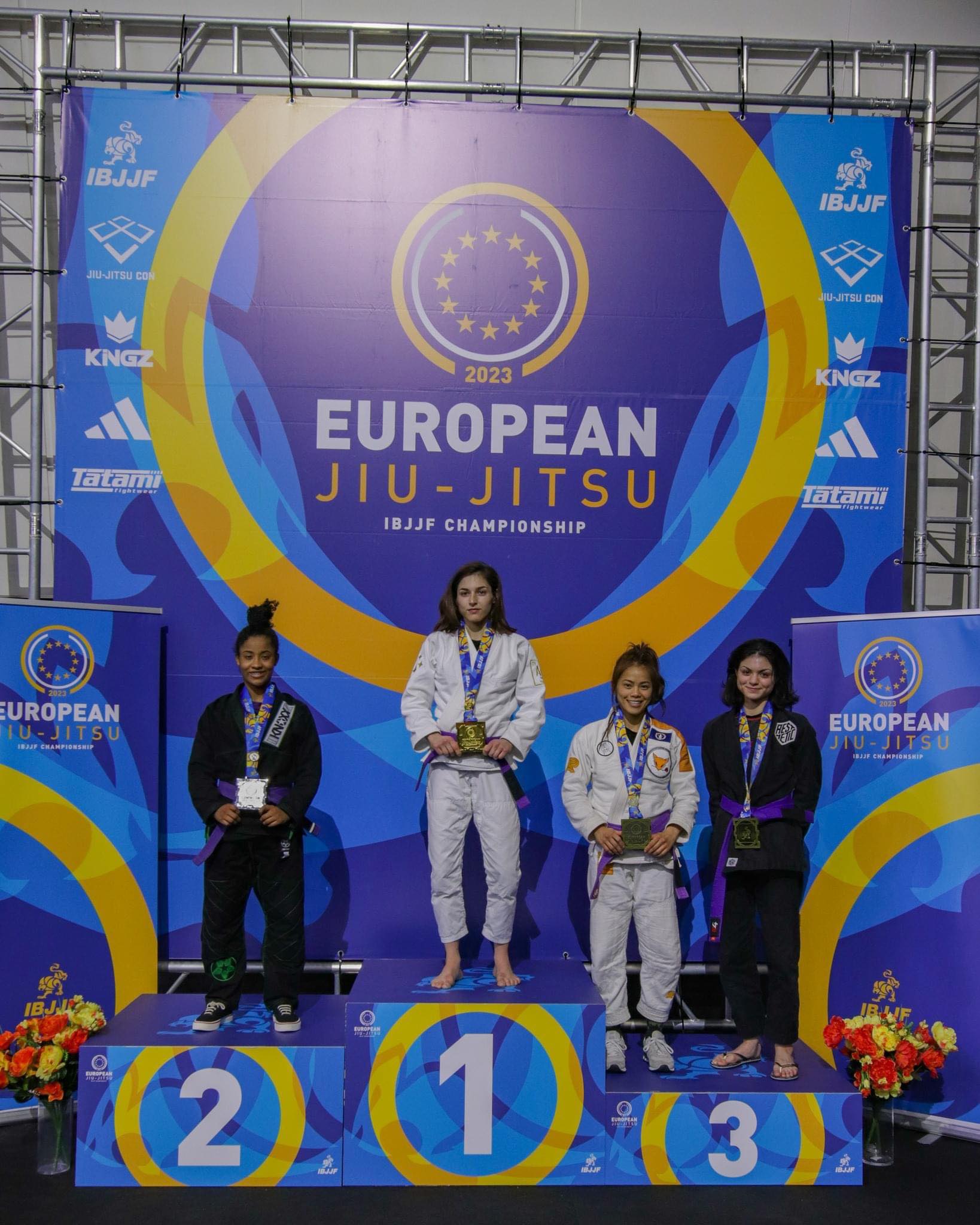 Marilyn Cruz, second  right, poses with the third place medal during the awards ceremony of the  2023 IBJJF European Championships held from Jan. 23 to 29 at the Institut du Judo in Paris, France.