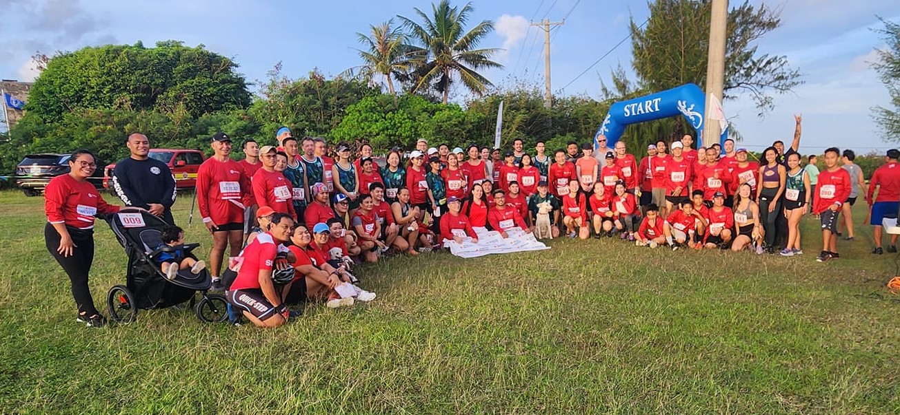 Participants of the inaugural American Red Cross-NMI Chapter’s Run for the Red 5K fundraiser event poses for a group photo Saturday at the Airport Field.