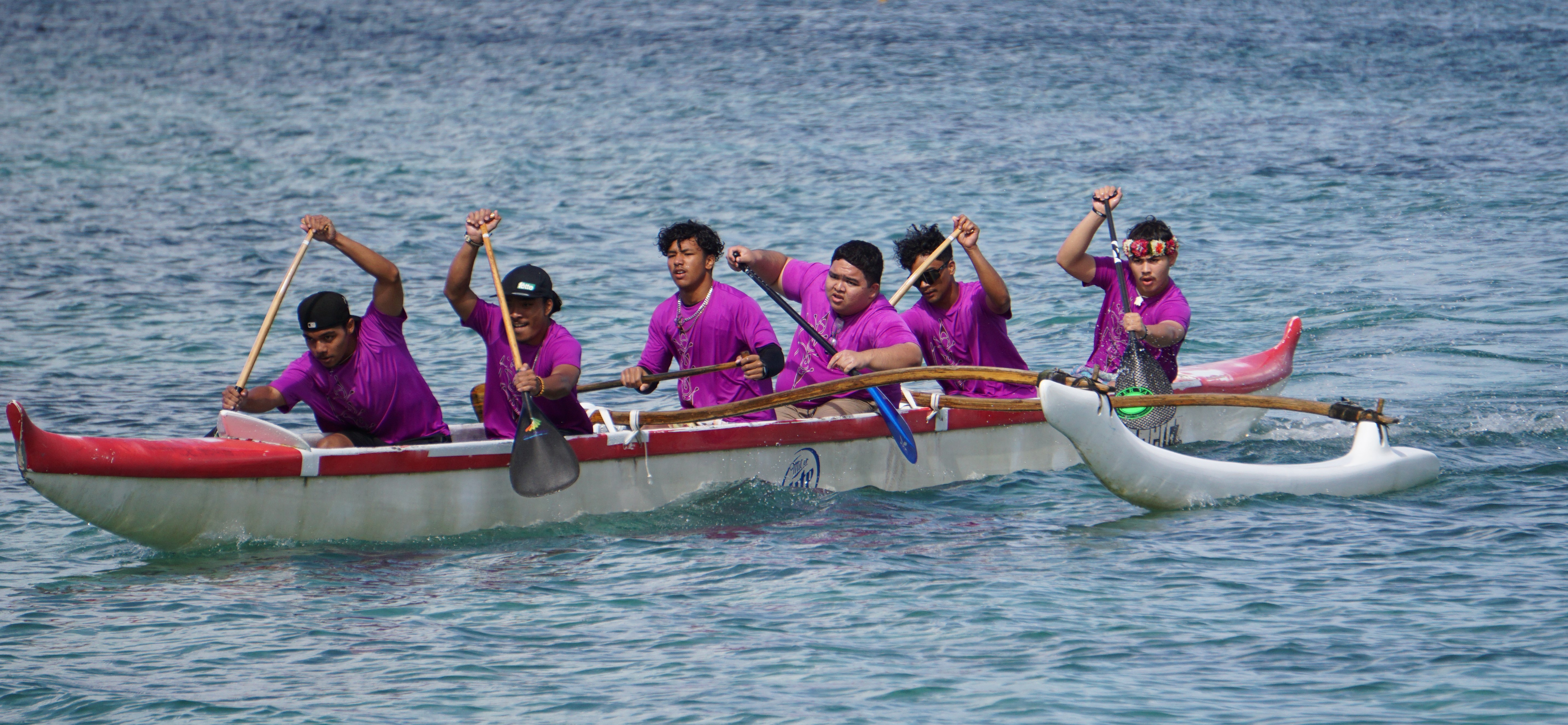 The KHS boys push through the 500m event in the high school division of the PSS Interscholastic Outrigger Race Series at Kilili Beach on Saturday.