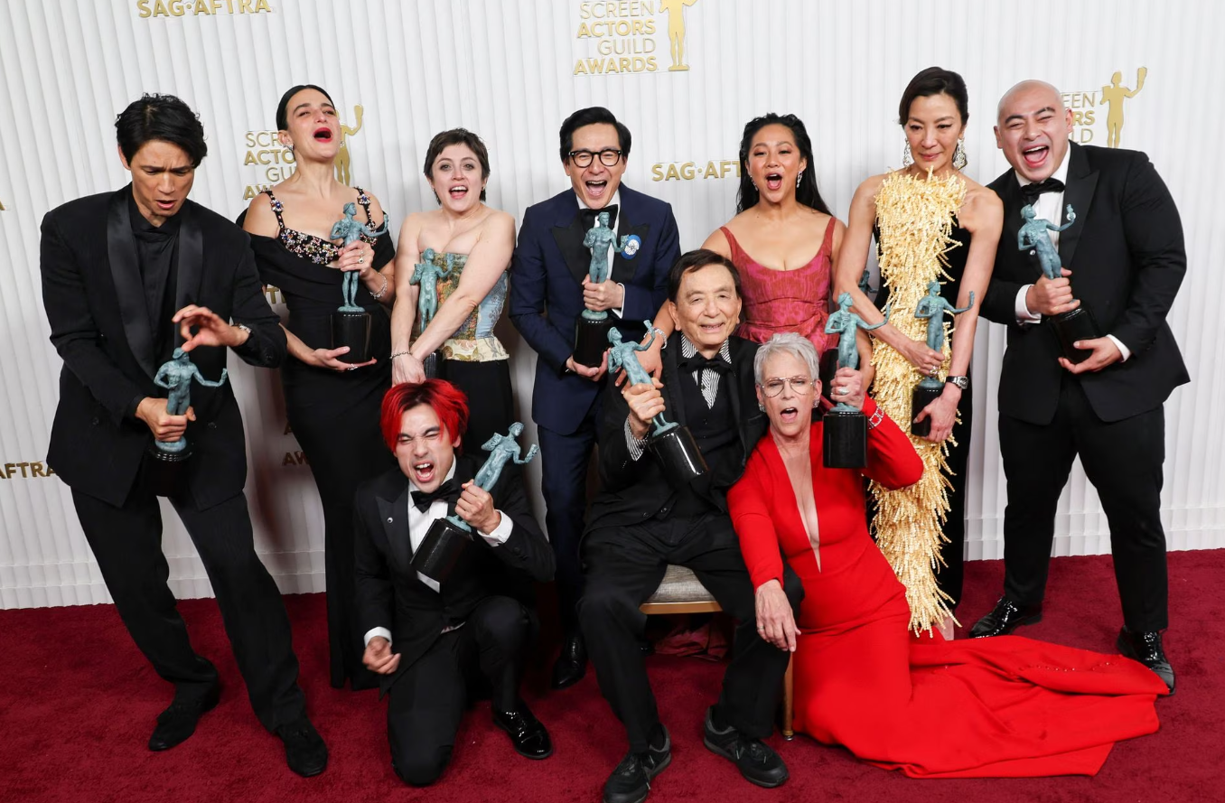 Members of the cast of "Everything Everywhere All at Once" Harry Shum Jr., Jenny Slate, Andy Le, Tallie Medel, Ke Huy Quan, James Hong, Stephanie Hsu, Jamie Lee Curtis, Michelle Yeoh and Brian Le pose with the award for Outstanding Performance by a Cast in a Motion Picture during the 29th Screen Actors Guild Awards at the Fairmont Century Plaza Hotel in Los Angeles, California, Feb. 26, 2023.