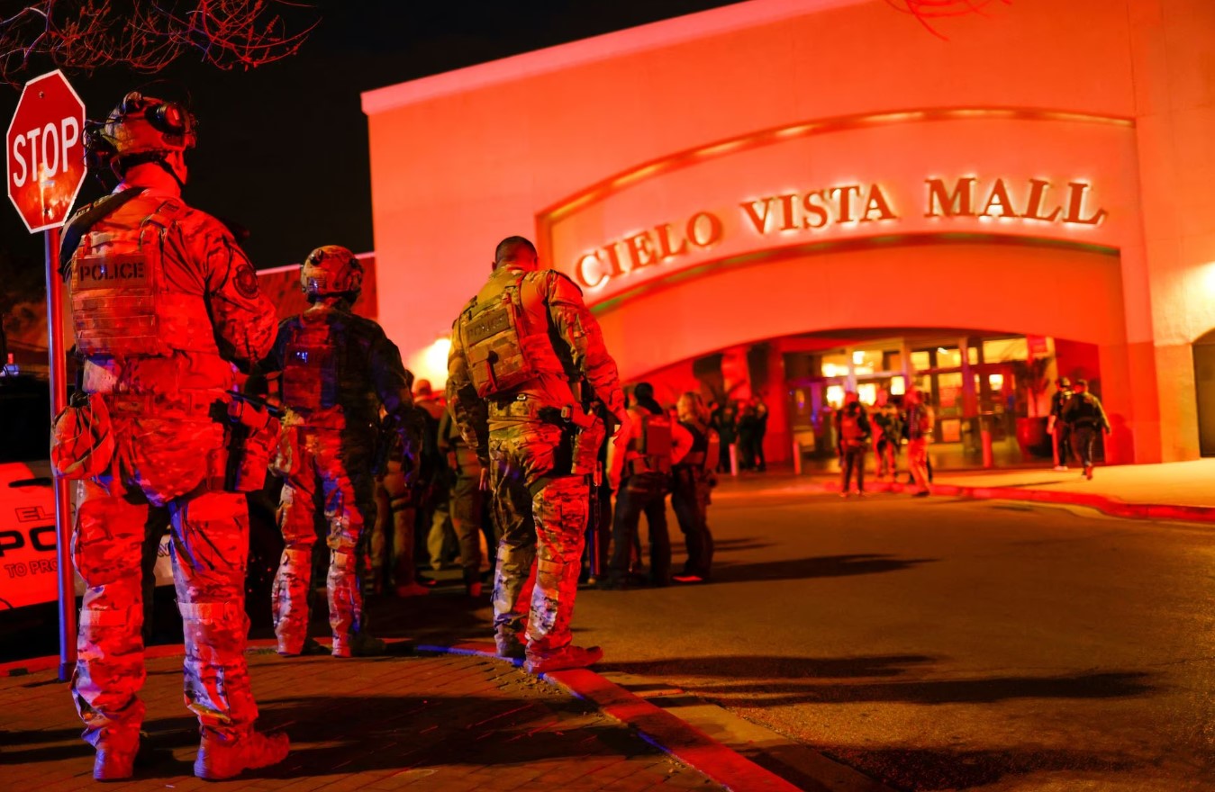 Law enforcement members gather outside the Cielo Vista Mall after a shooting, in El Paso, Texas,  Feb. 15, 2023.