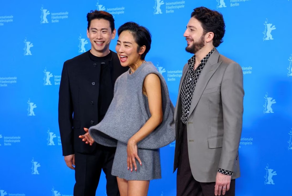 Cast members Greta Lee, John Magaro and Teo Yoo attend a photo call to promote the movie “Past Lives” at the 73rd Berlinale International Film Festival in Berlin, Germany, Feb. 19, 2023.