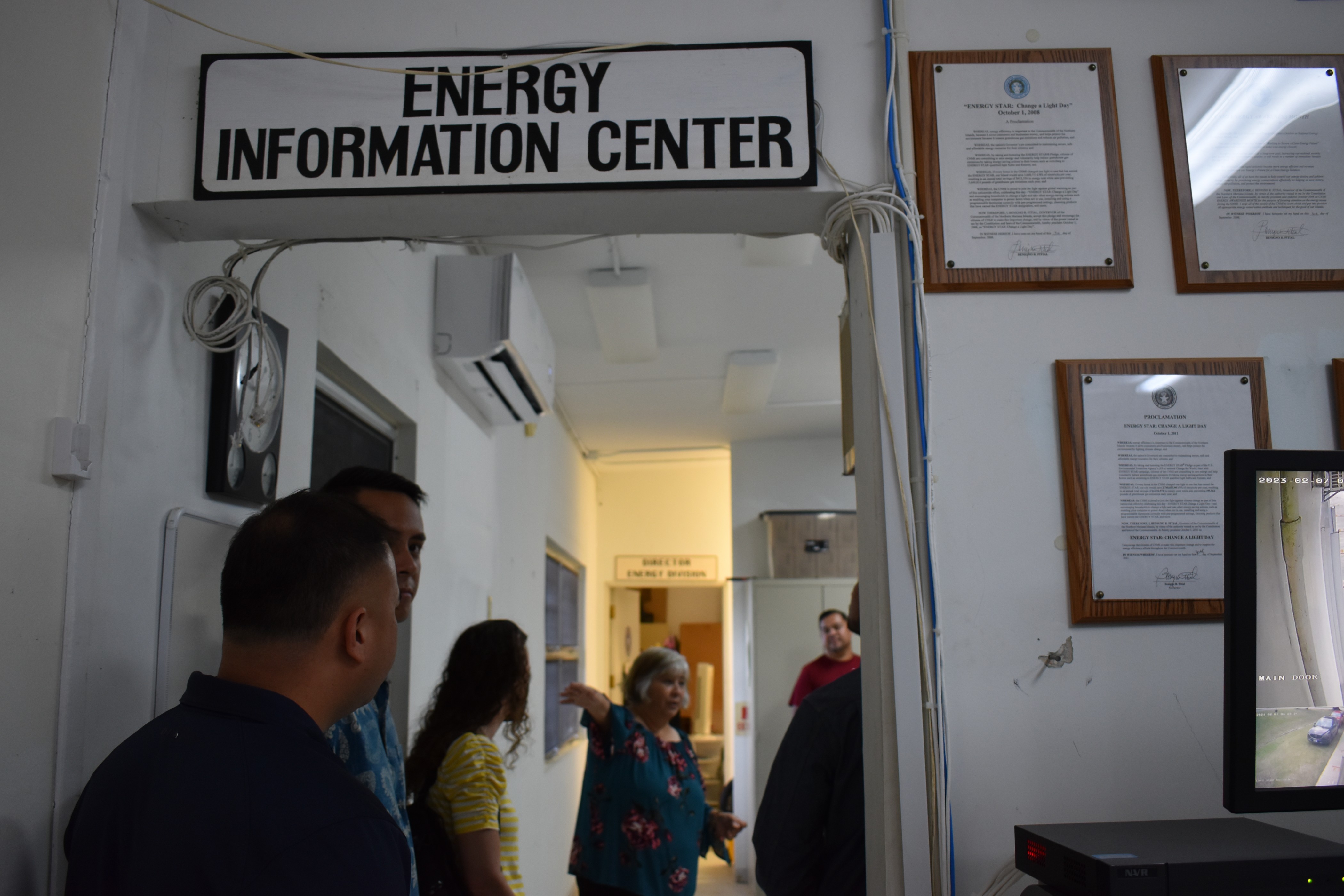 Department of Public Works-Division of Energy Director Thelma Inos, fourth from left, walks representatives from the Commonwealth Utilities Corporation, Pacific Northwest National Laboratory, U.S. Department of Energy and the Office of Planning and Development through the alternative energy systems found at the DPW Division of Energy office and discusses ongoing work. 