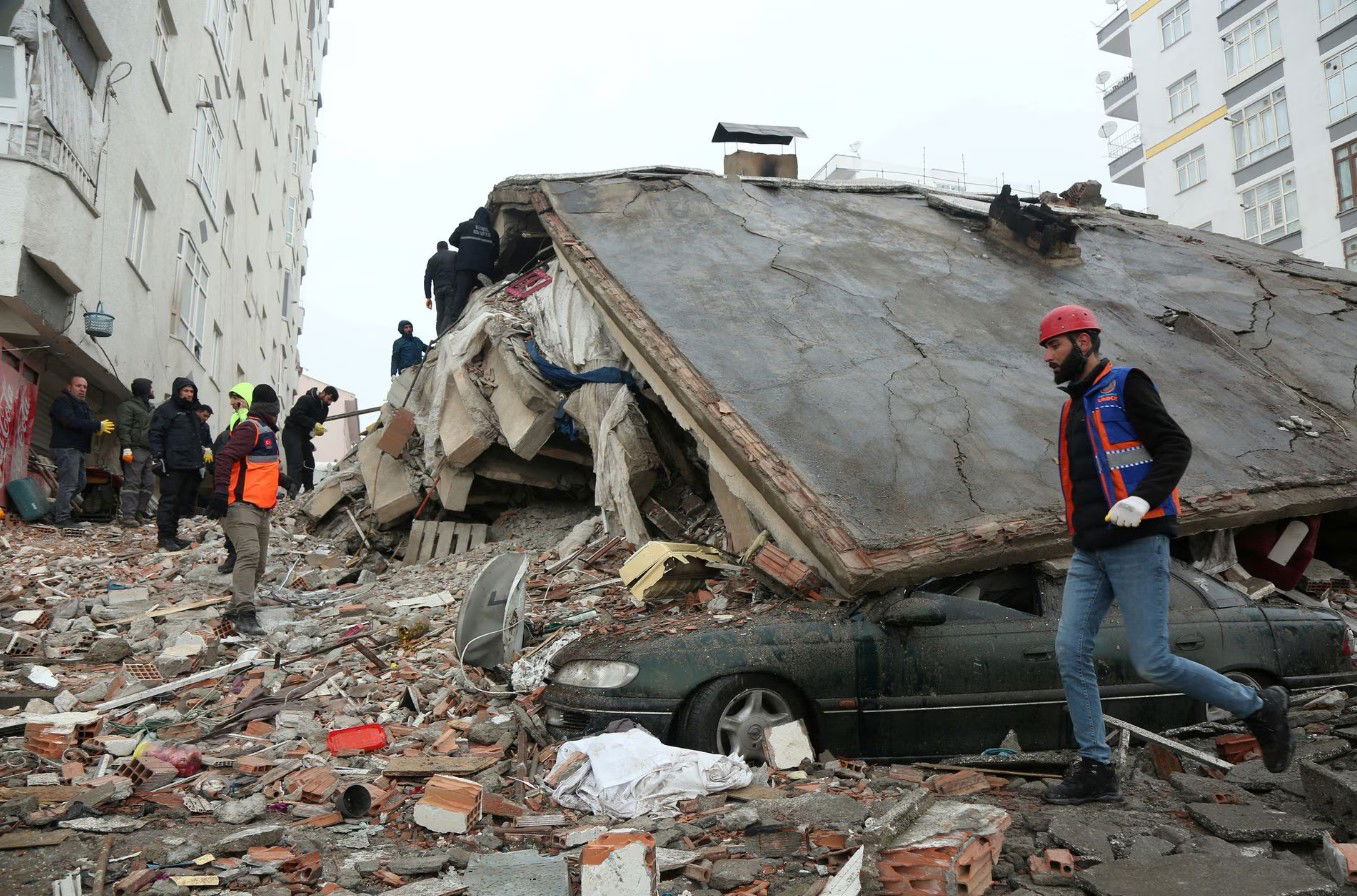 Rescuers search for survivors under the rubble following an earthquake in Diyarbakir, Turkey Feb. 6, 2023.