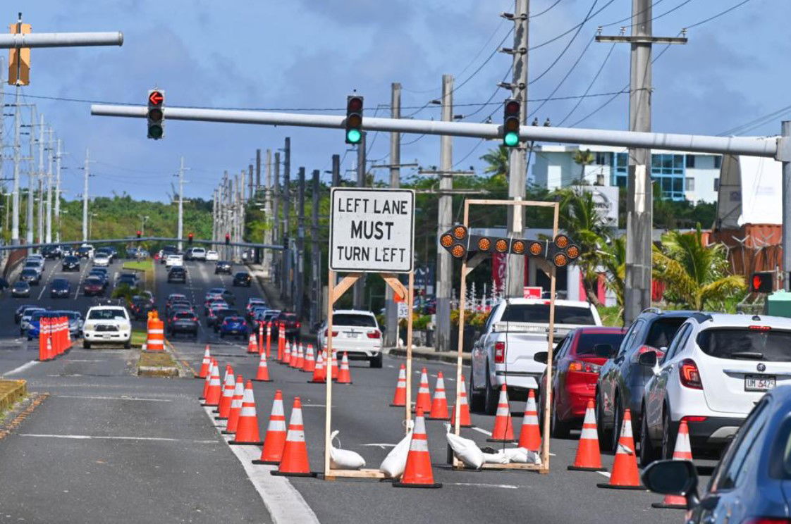 Traffic slows to a crawl as work begins on Marine Corps Drive in advance of moving heavy equipment for the construction of the Ukudu Power Plant on Dec. 12, 2022 in Upper Tumon.