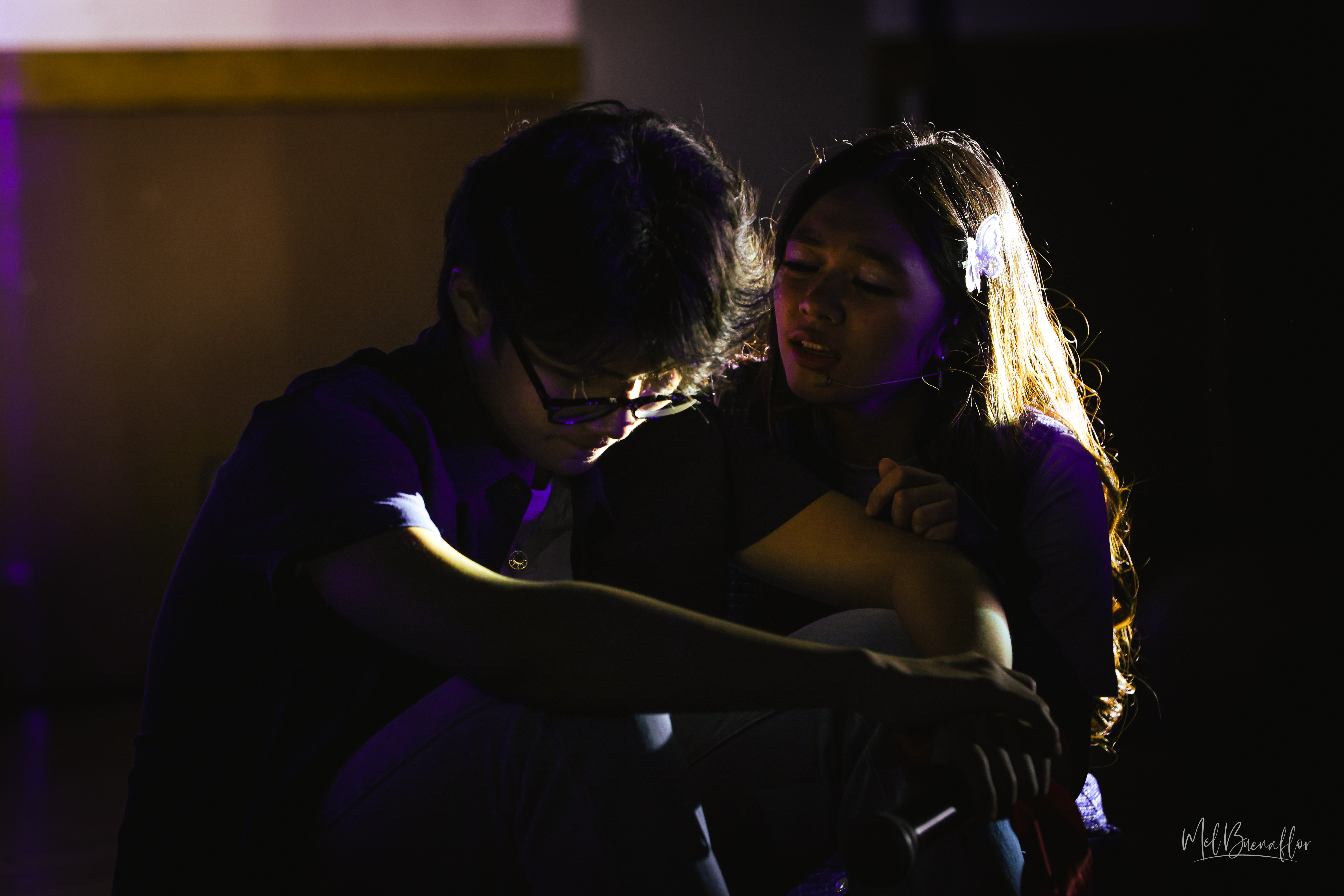 Iris, played by Bernice Shane Sabino, right, comforts her love interest in the show, Luke, played by Eunkyu "Joey" Hong, as she sings “Fix You.”