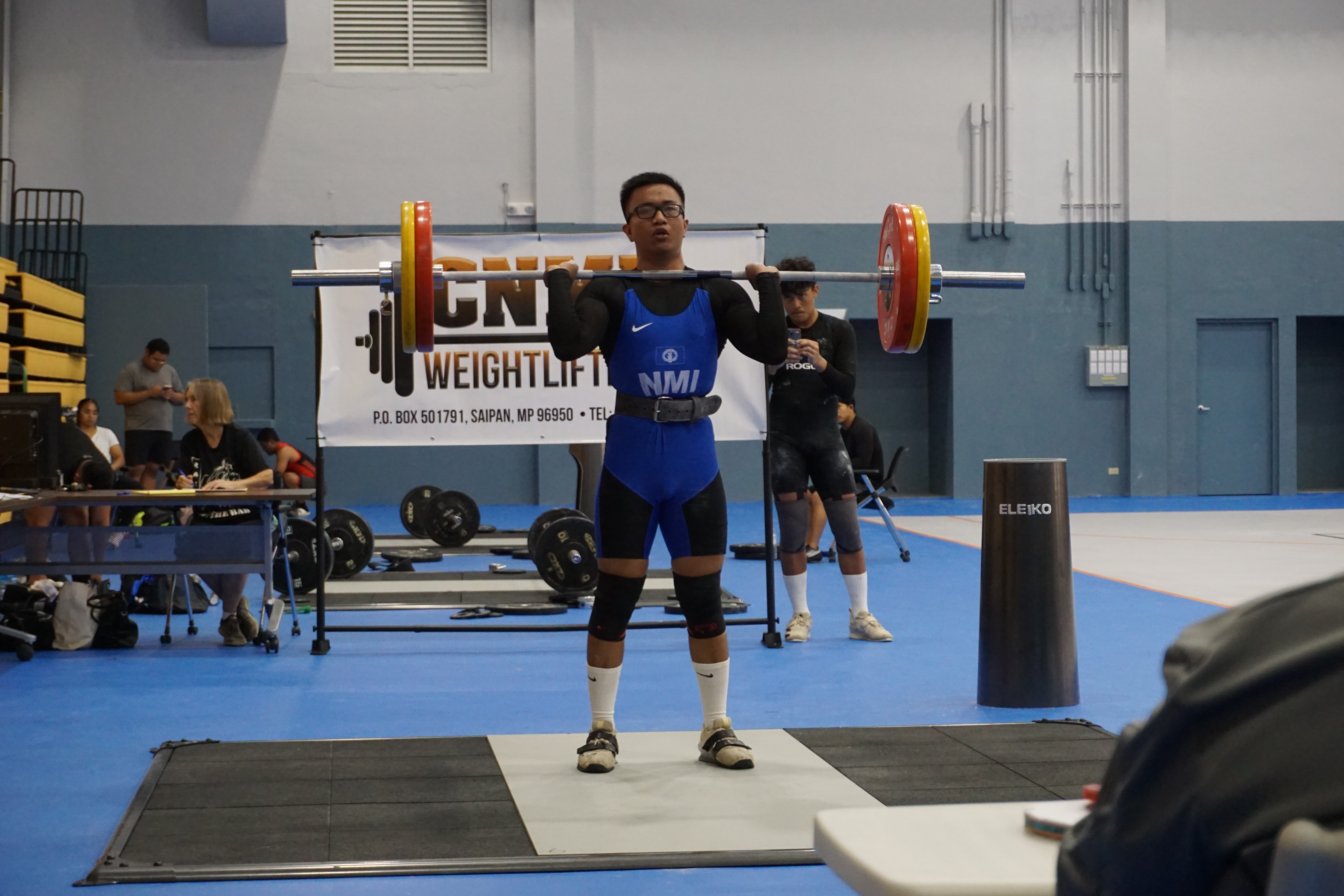 Emmanuel Aquino gathers his strength before transitioning to the second half of the clean & jerk portion of a CNMI Weightlifting qualifier event at the Ada gym last month.