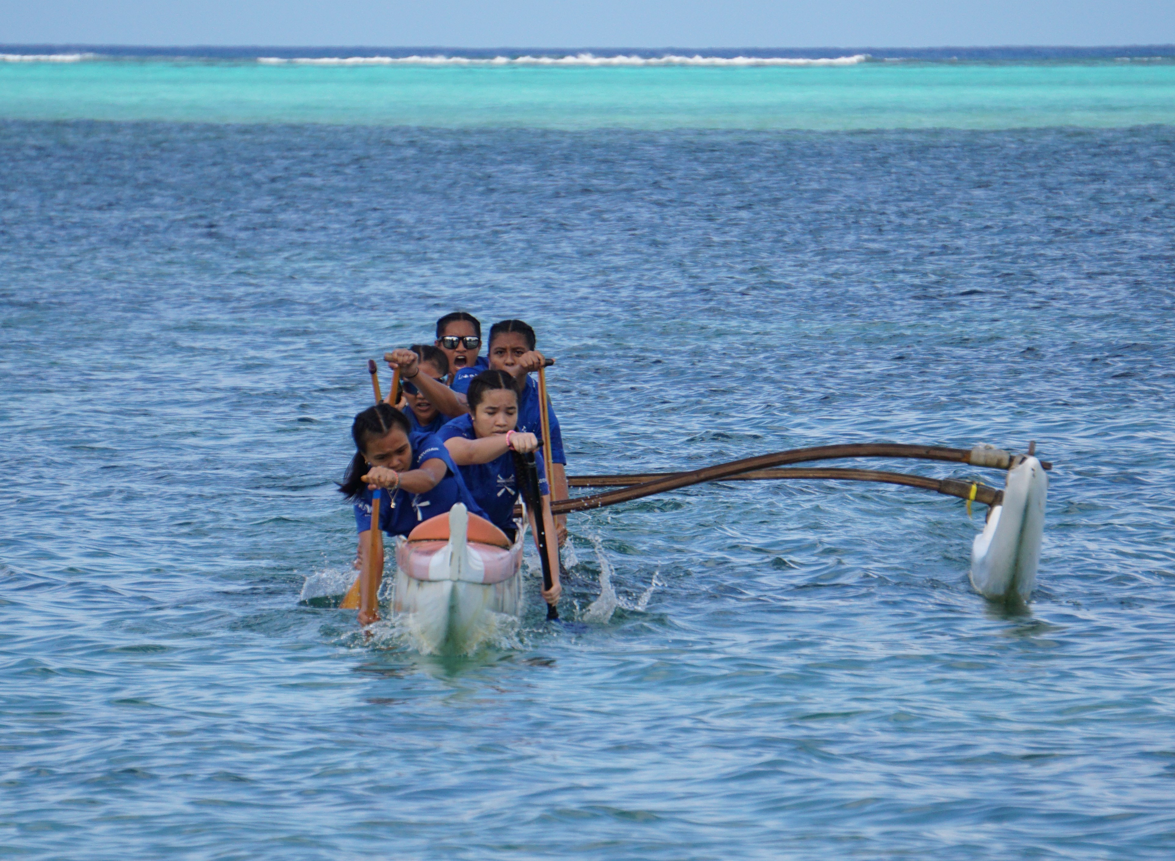 The Marianas High School Women's Team goes through the last leg of a race in the 2022-2023 season of the PSS Interscholastic Outrigger Race series on Saturday at Kilili Beach.