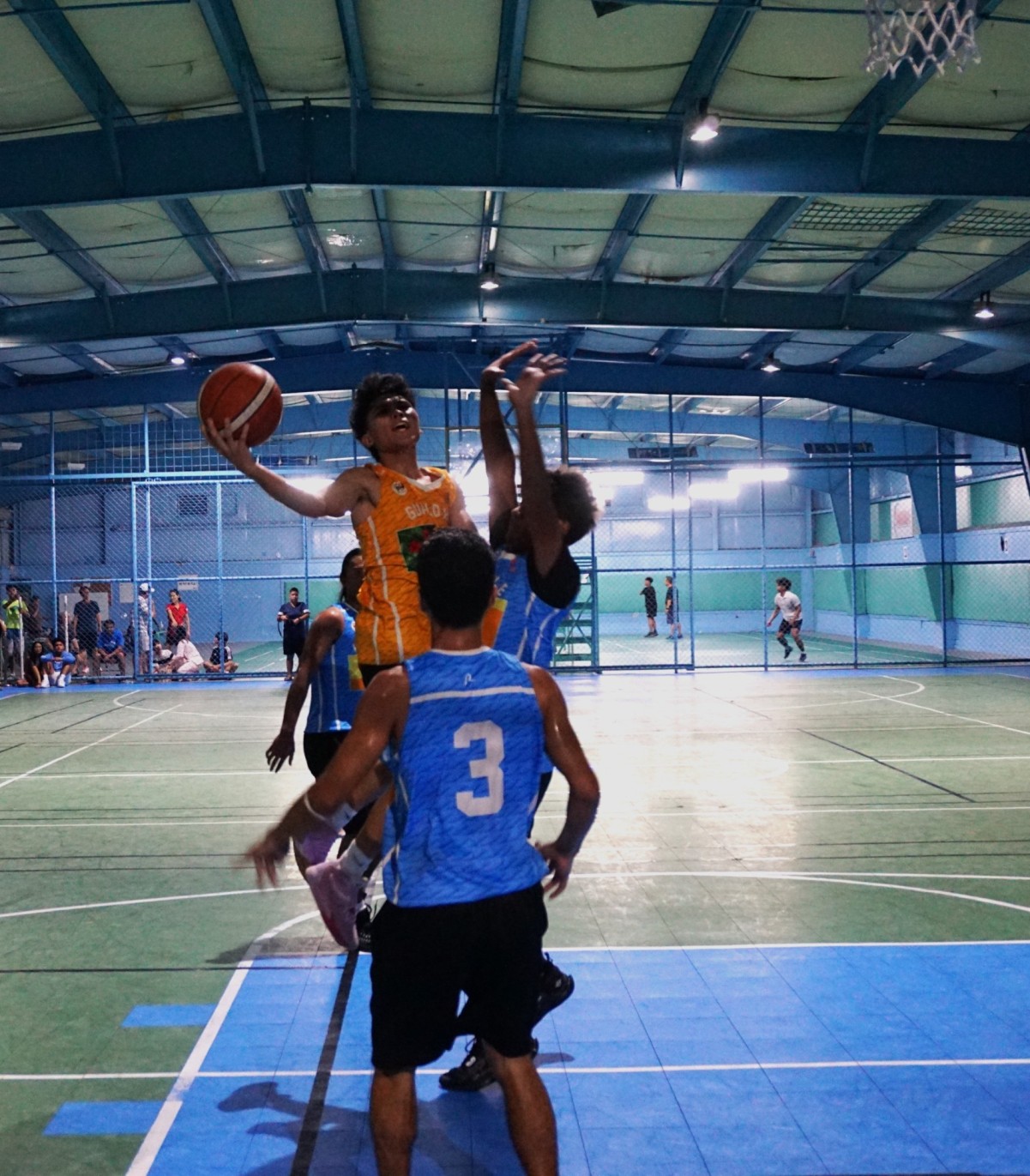 U18 Gualo Rai's Lucio Aldan extends as he gets fouled in midair.