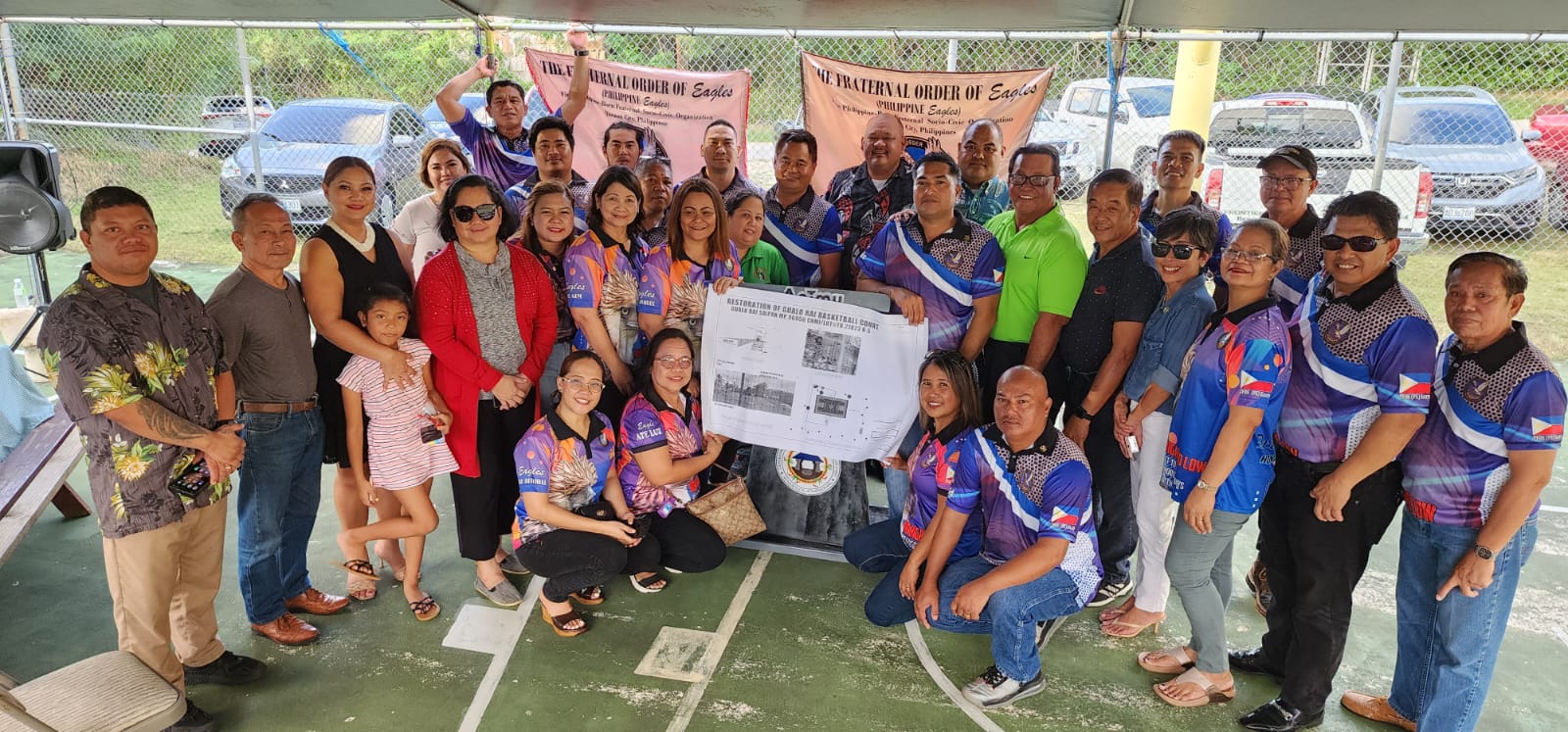 Saipan Eagles Club officers and members pose for a photo with Saipan Mayor RB Camacho, CNMI lawmakers and other officials at the Gualo Rai basketball court on Friday, Feb. 17, 2023.