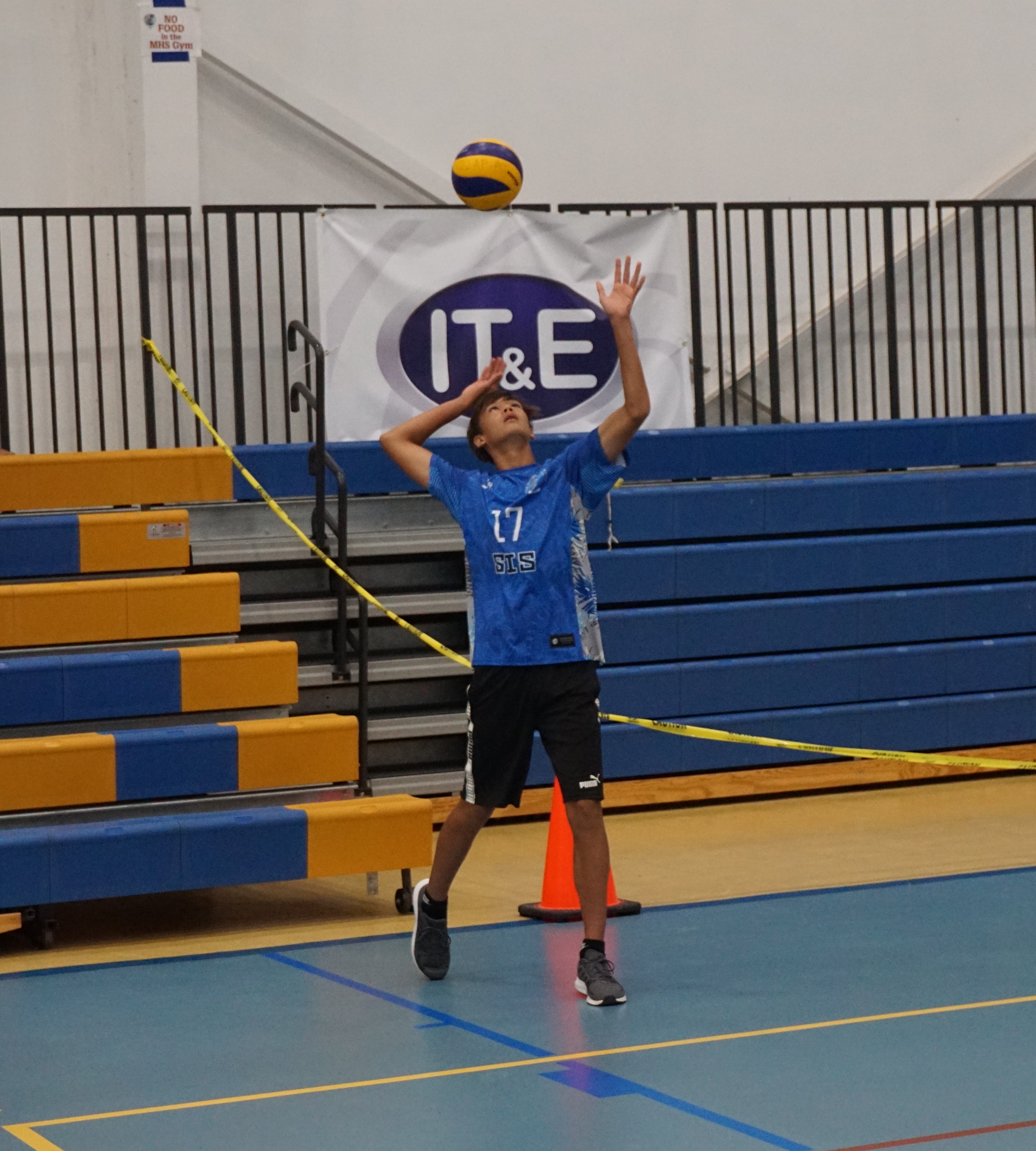 SIS varsity player Moshe Sikkel attempts the overhead serve during a boys middle school division game of the NMIVA-PSS Interscholastic Volleyball League at the MHS gym.