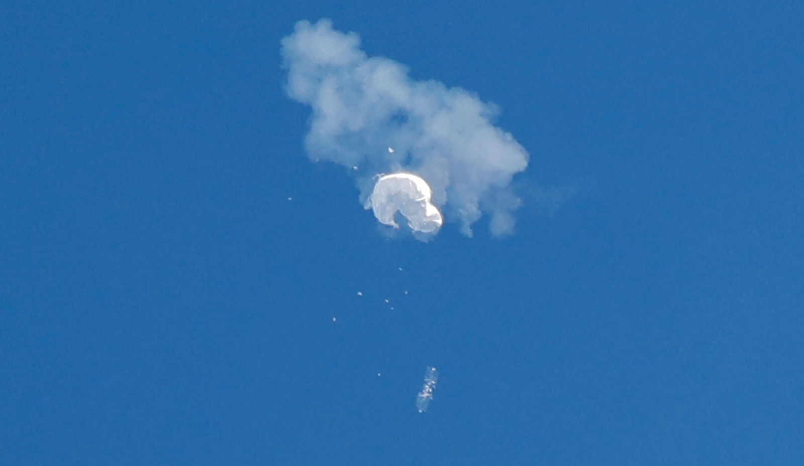 The suspected Chinese spy balloon drifts to the ocean after being shot down off the coast in Surfside Beach, South Carolina, Feb. 4, 2023.