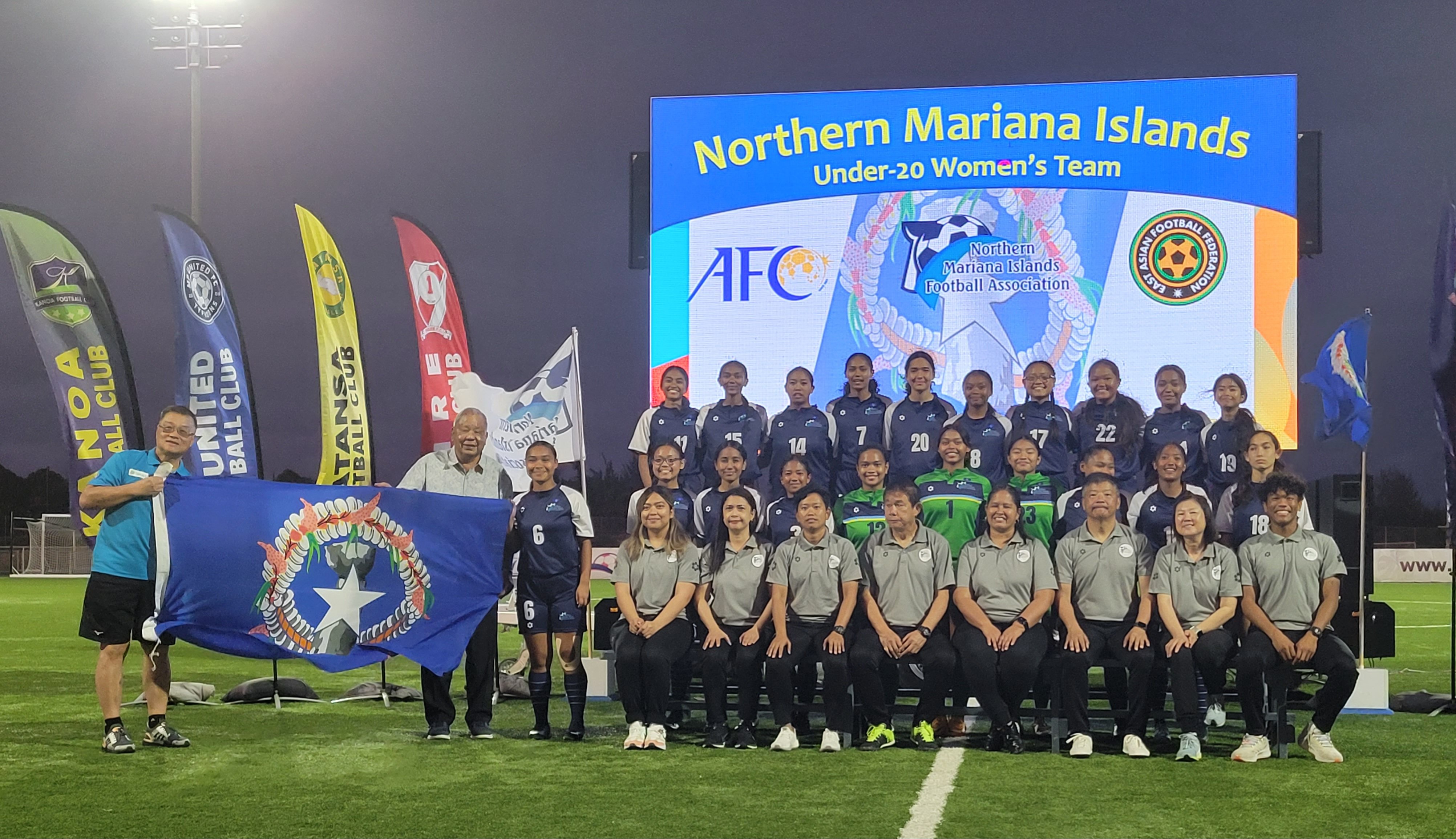 The NMI U20 Women's National Soccer Team members pose for a photo with Lt. Gov David M. Apatang and NMI Football Association President Jerry Tan during a send-off ceremony Wednesday at the NMI Soccer Training Center in Koblerville.